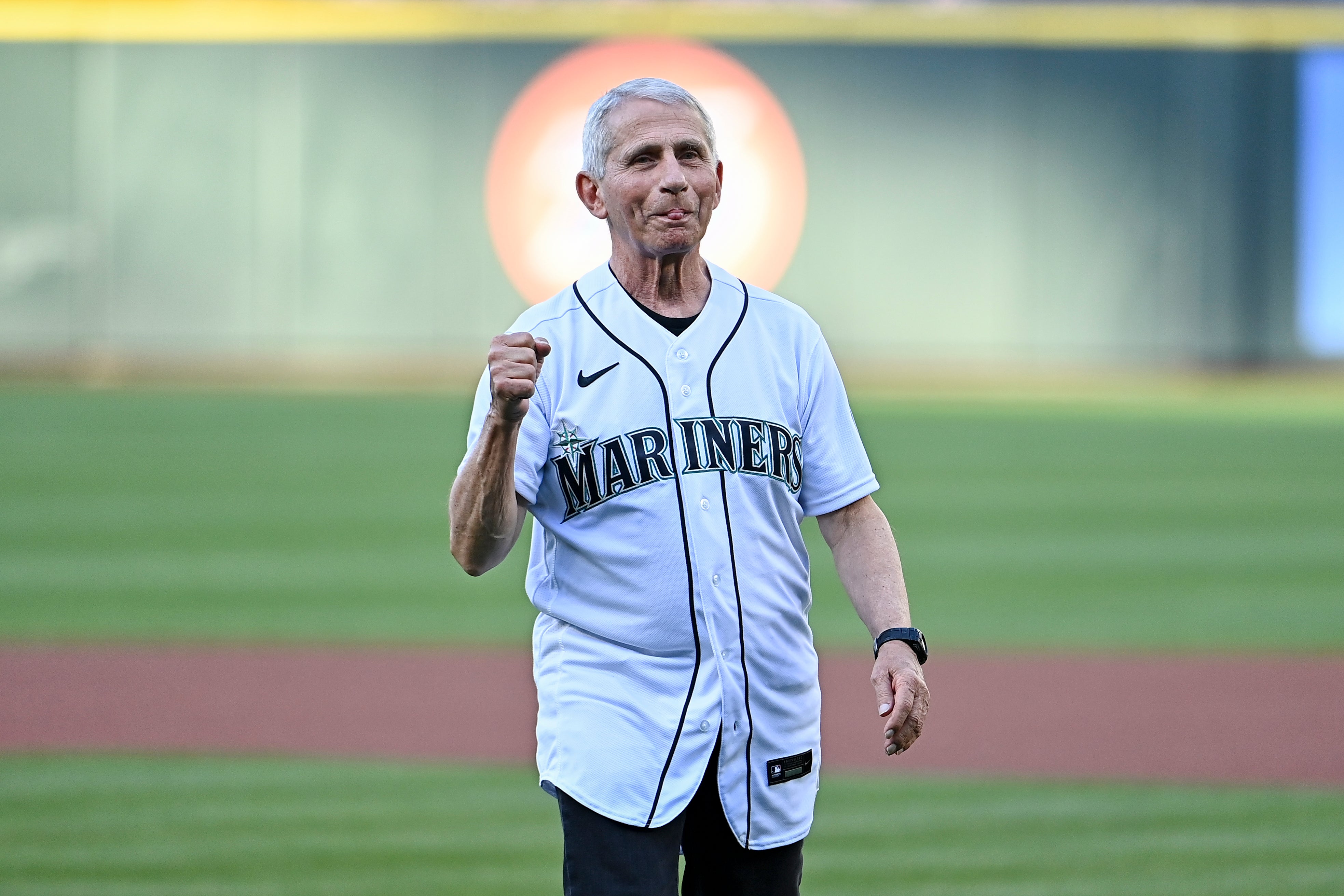 Dr. Anthony Fauci, director of the National Institute of Allergy and Infectious Diseases and chief medical advisor to the U.S. president, throws out the ceremonial first pitch before the game between the Seattle Mariners and the New York Yankees at T-Mobile Park on August 09, 2022 in Seattle, Washington