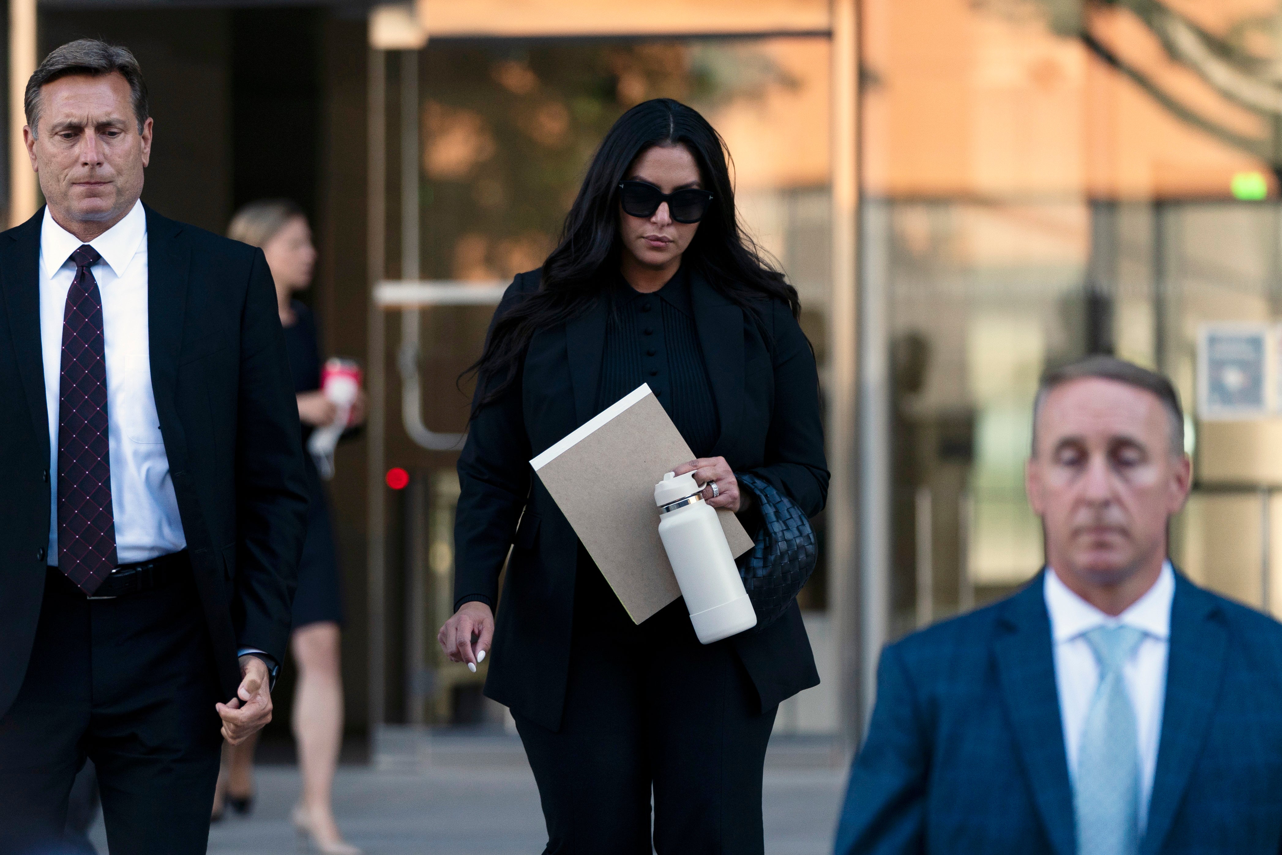 Vanessa Bryant, center, the widow of Kobe Bryant, leaves a federal courthouse in Los Angeles, Wednesday, Aug. 10, 2022.