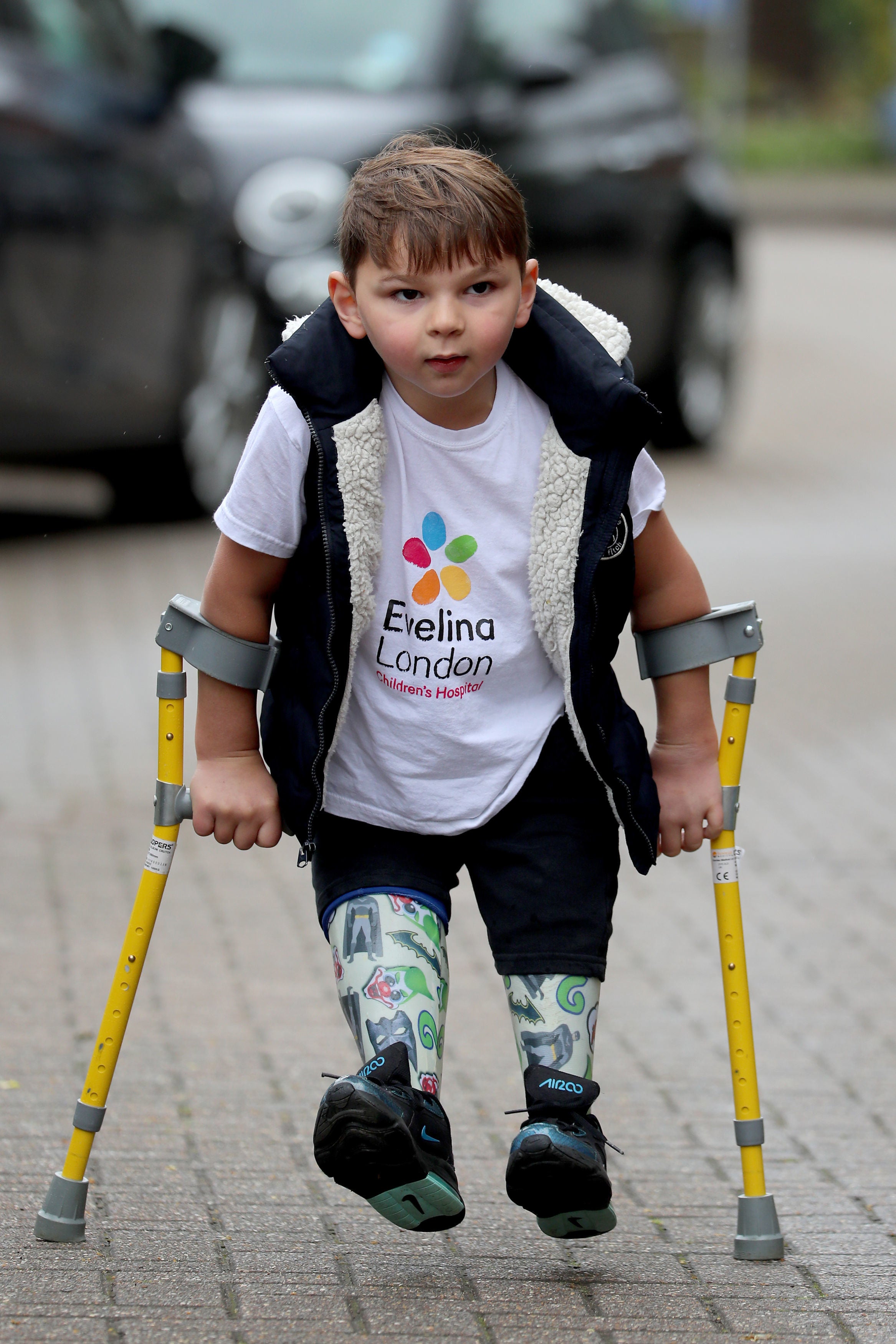 Tony Hudgell, who uses prosthetic legs, takes the final steps in his fundraising walk in West Malling Kent. Five-year-old Tony has raised more than �1,000,000 for the Evelina London Children’s Hospital, who have cared for him since he was four-months-old, by walking every day in June, covering a distance of 10 kilometres.