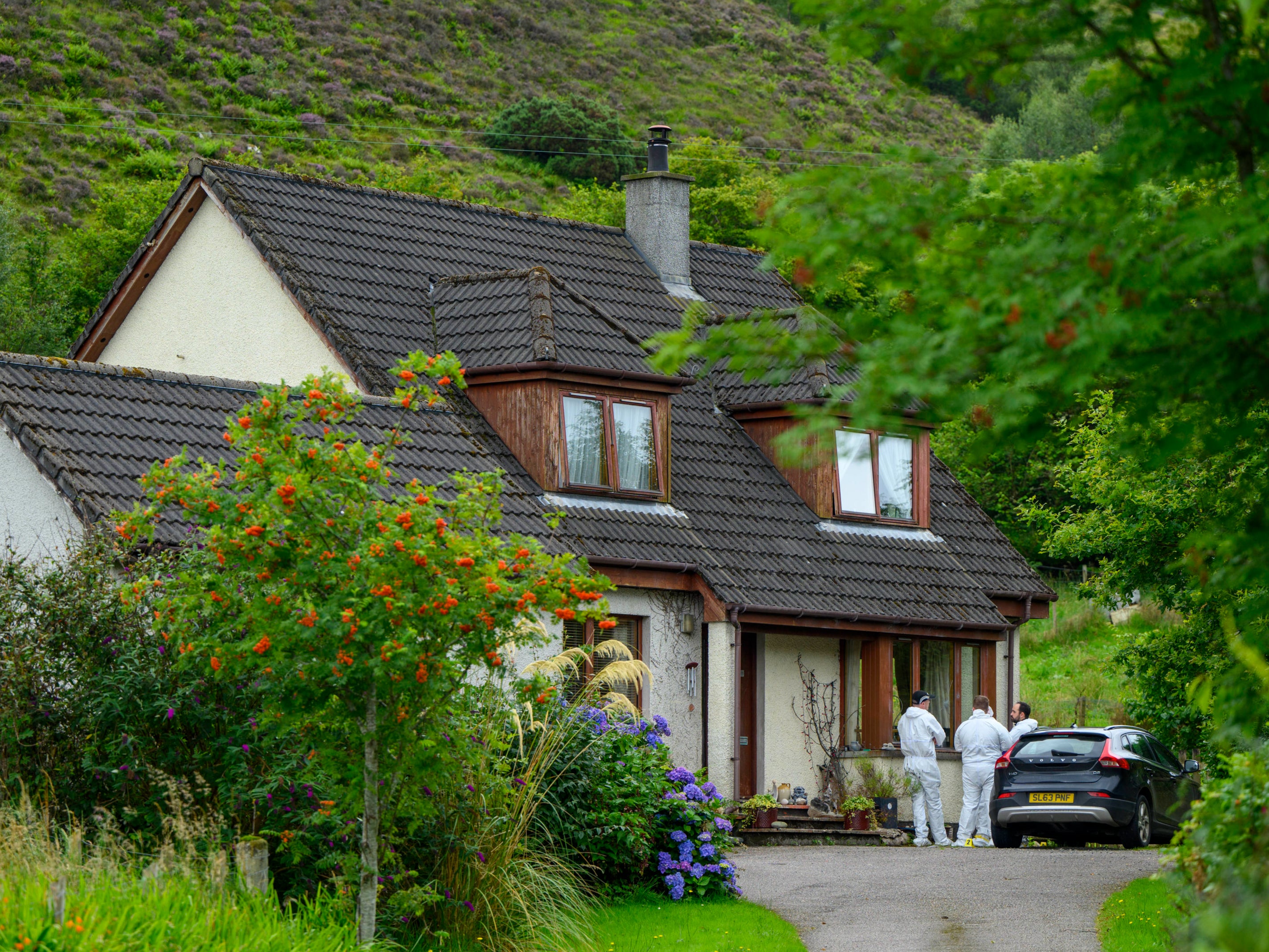 Forensics officers at the house in Dornie, Wester Ross