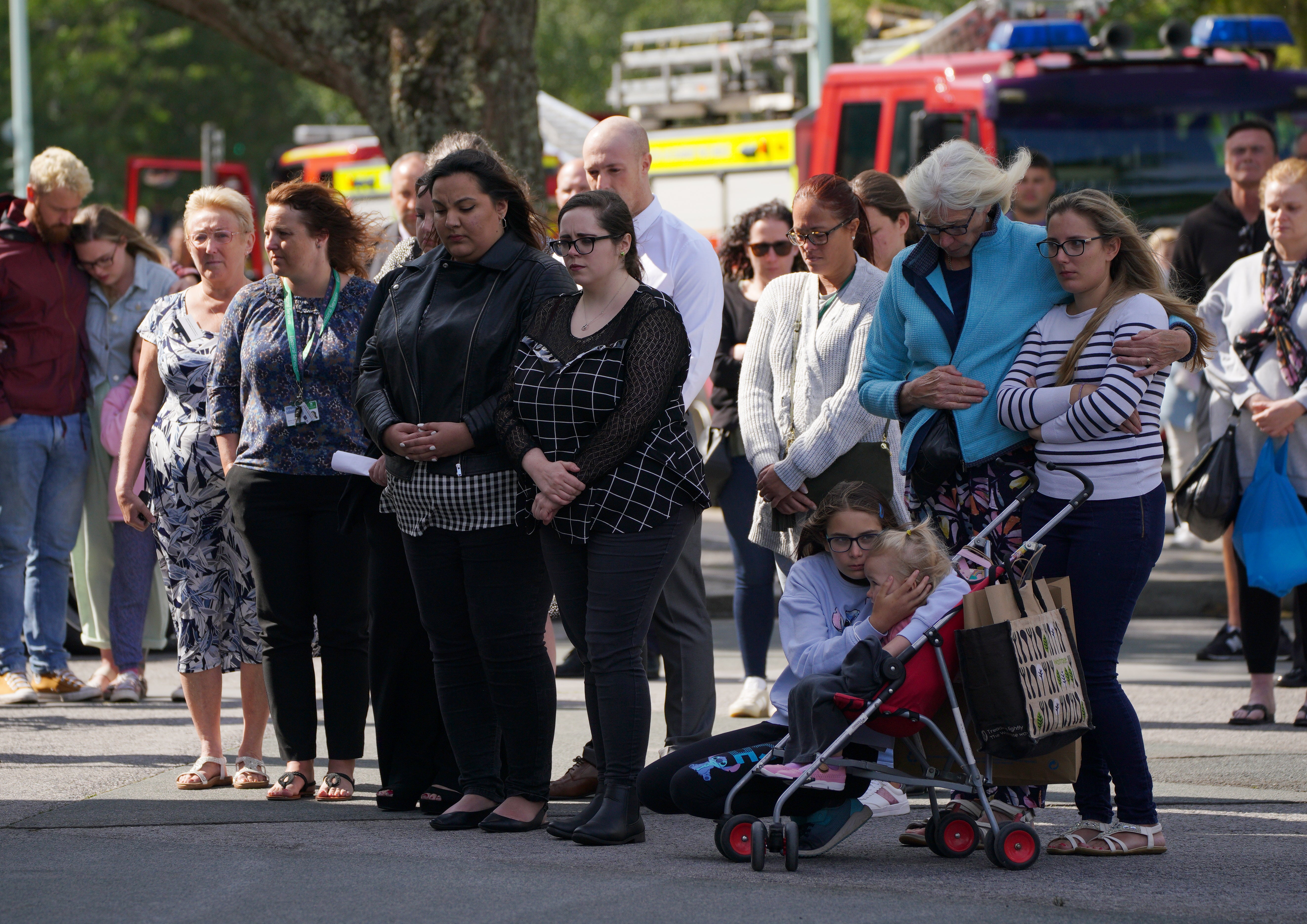 People take part in a minute’s silence (PA)