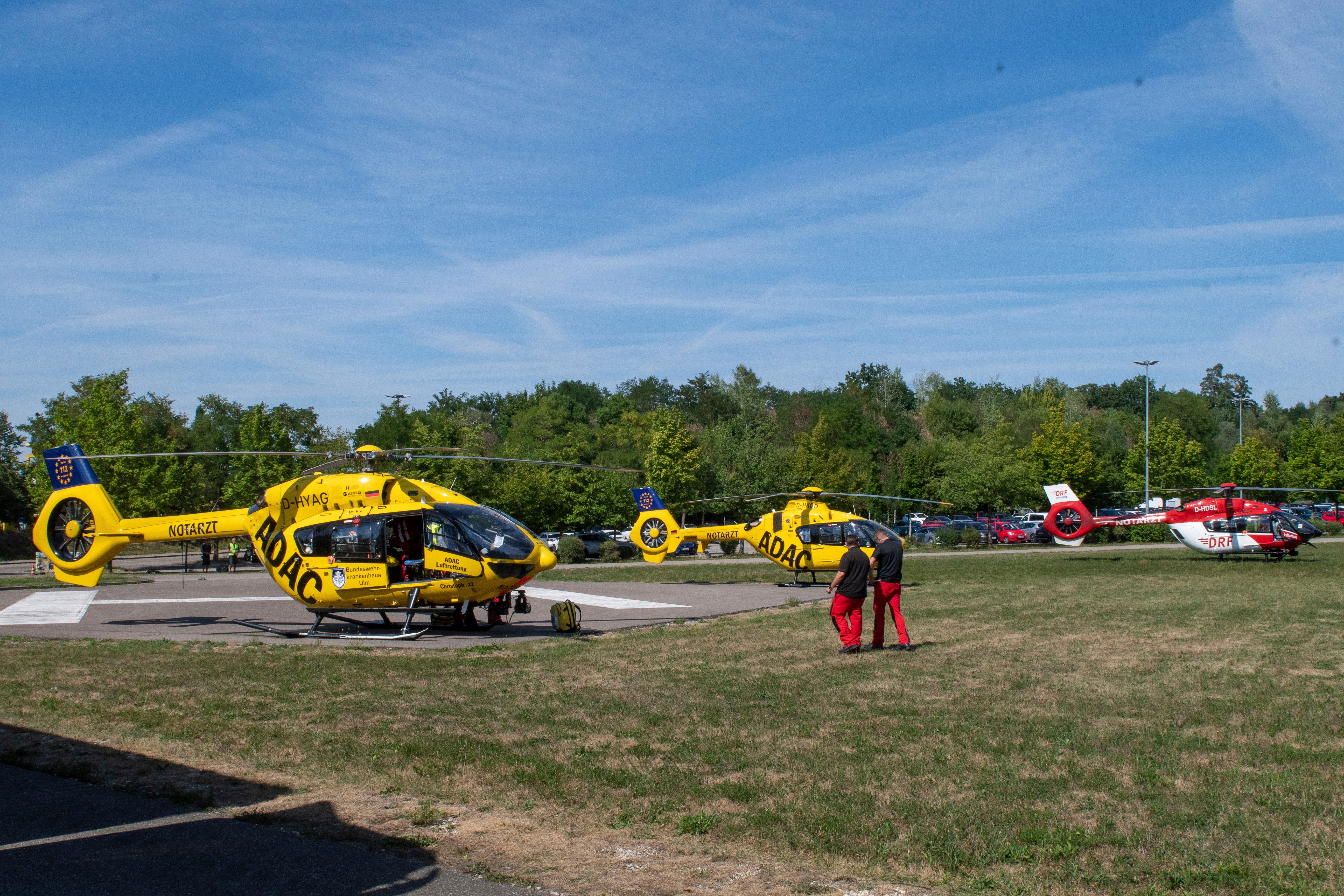 Rescue helicopters are seen in a field near the 'Legoland' amusement park in Guenzburg