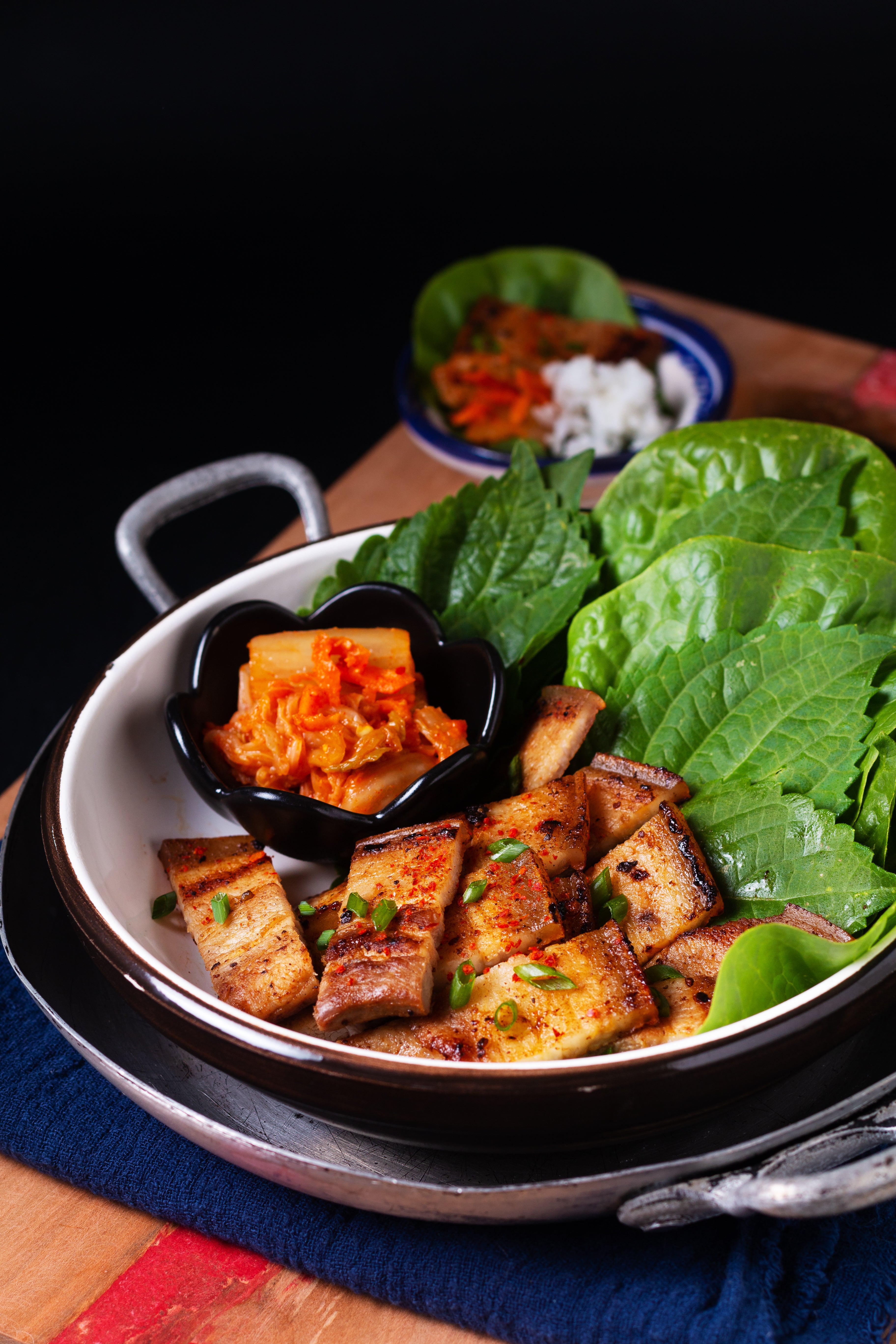 Samgyeopsal means ‘three-layer meat’ and refers to pork belly’s fat cap and the two leaner layers of meat below it