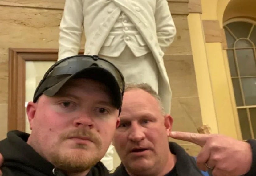 Jacob Fracker (left) and Thomas Robertson (right) inside the US Capitol on January 6