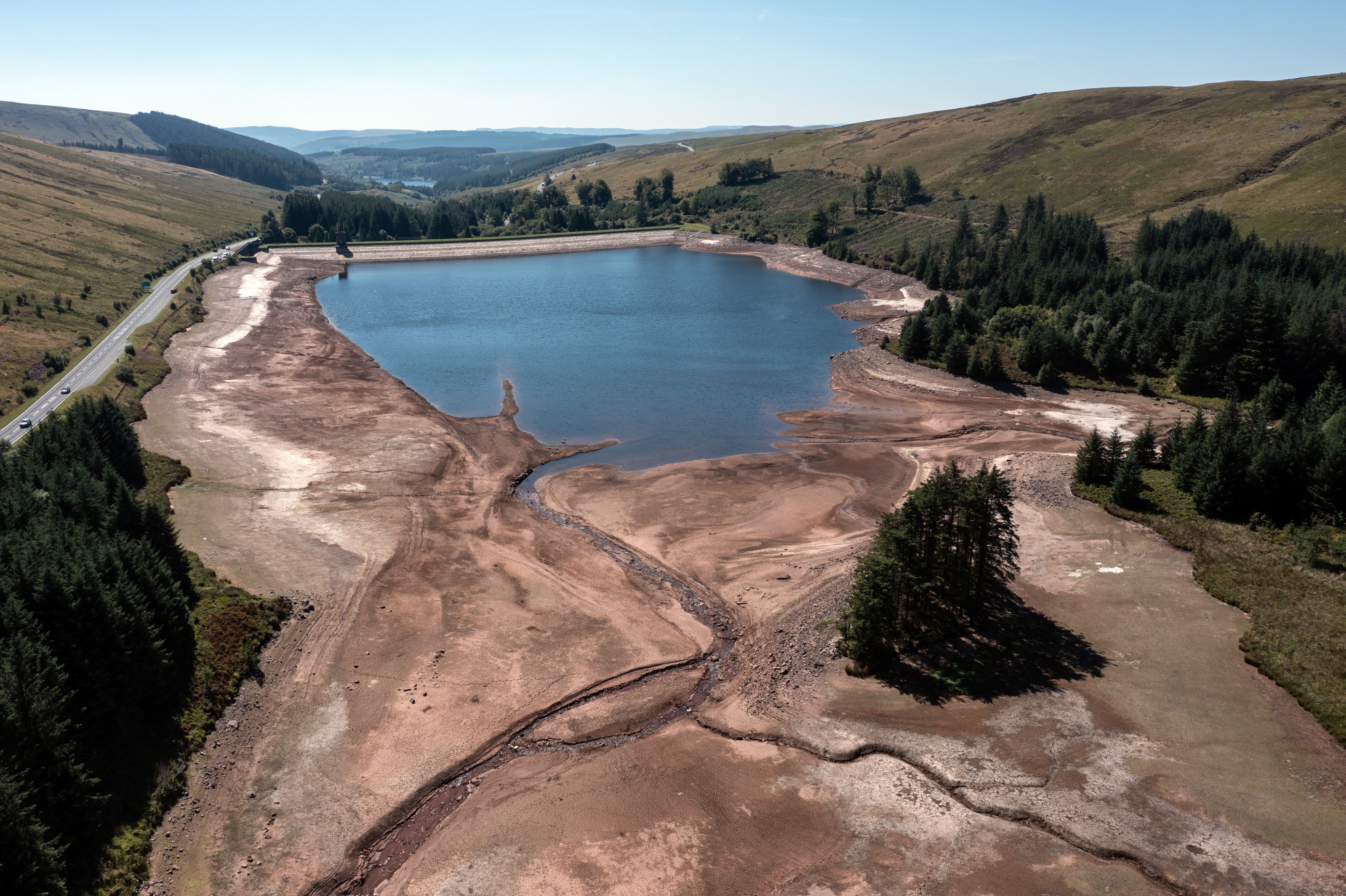 The water level at Beacons Reservoir lies low during the current heat wave in Merthyr Tydfil, Wales