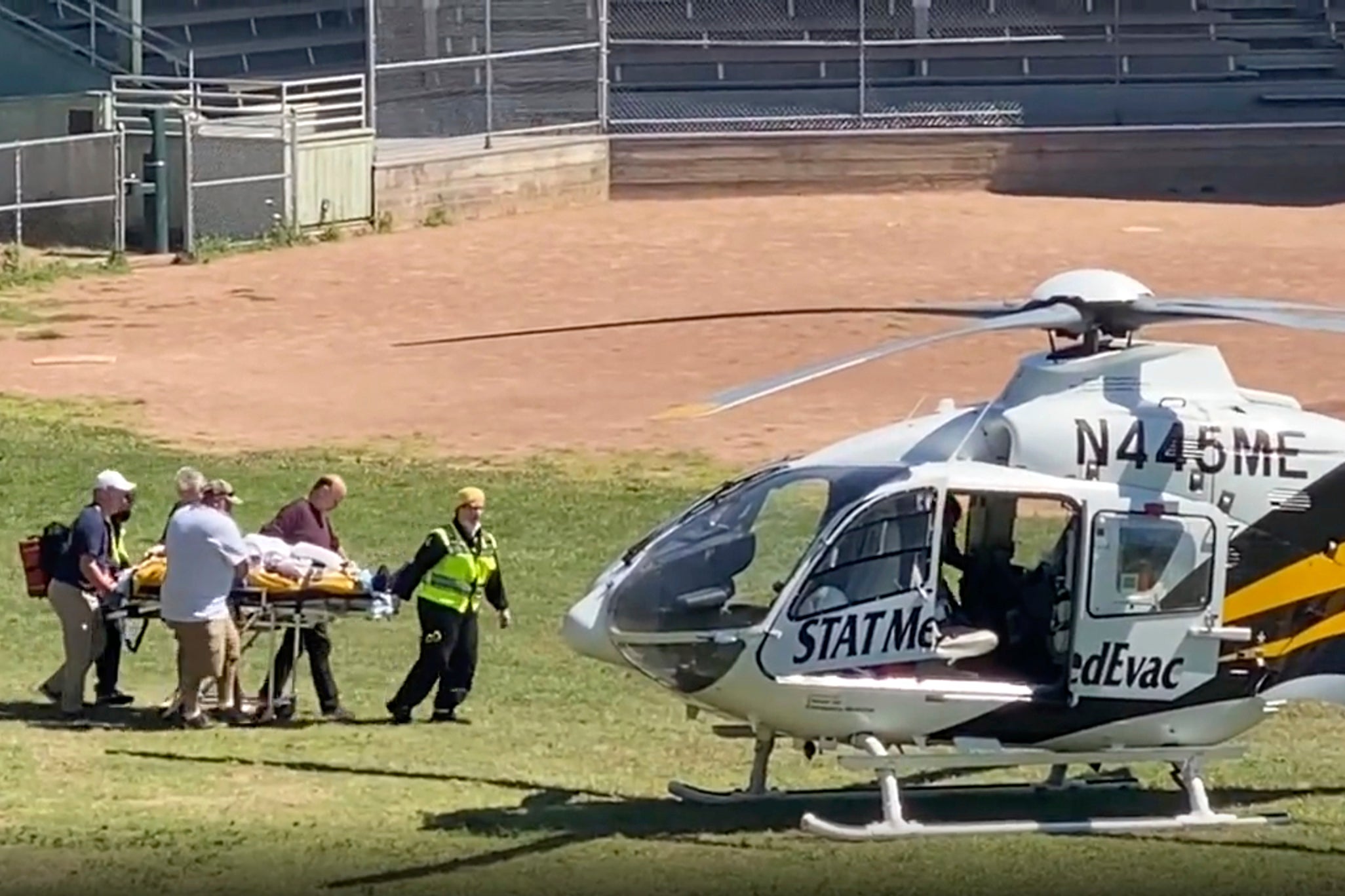 In this still image from video, author Salman Rushdie is taken on a stretcher to a helicopter for transport to a hospital