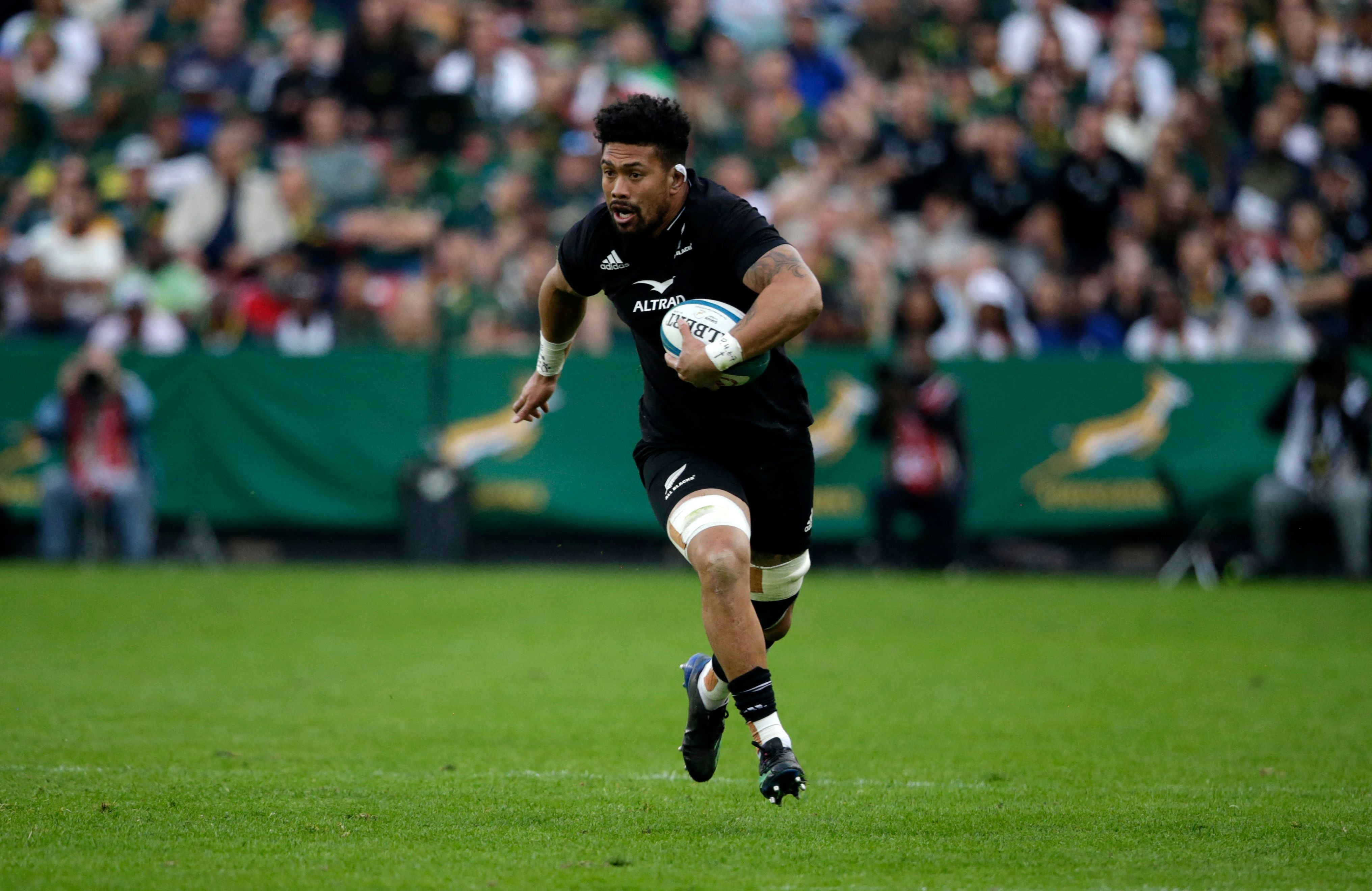 New Zealand's number eight Ardie Savea runs with the ball