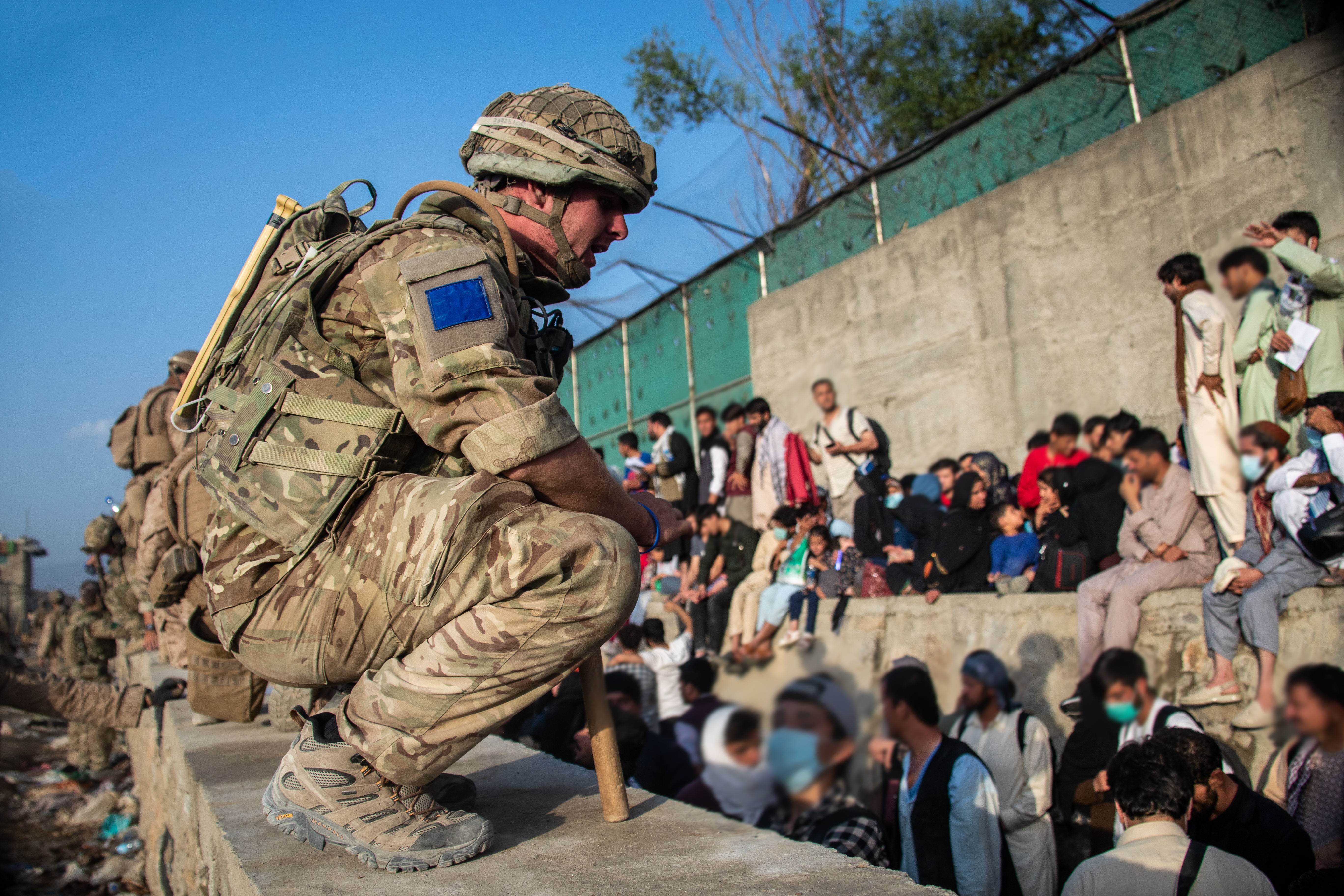 Afghans queue for an evacuation flight out of Kabul (LPhot Ben Shread/MoD/PA)