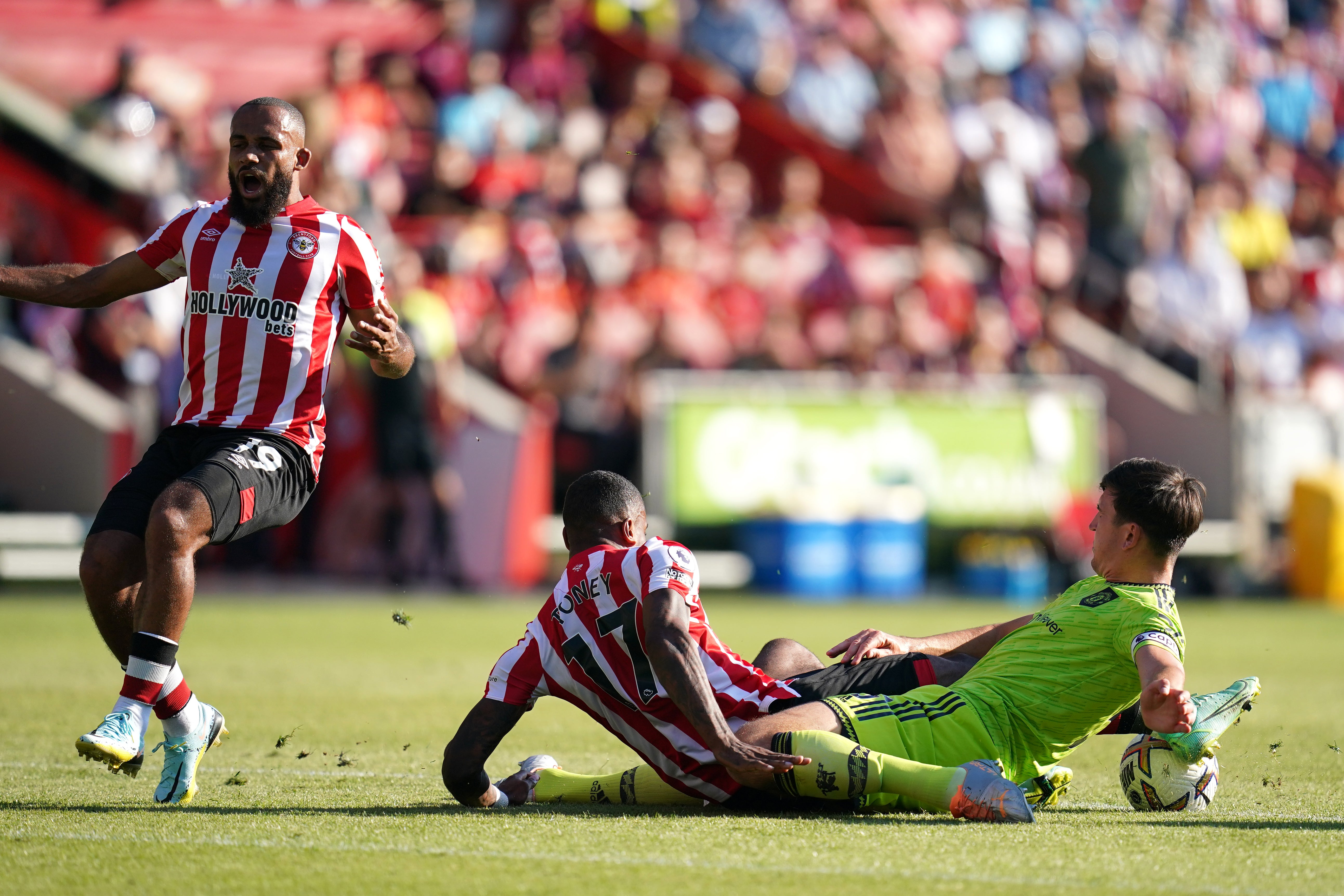 Harry Maguire, right, fouls Brentford’s Ivan Toney (John Walton/PA)