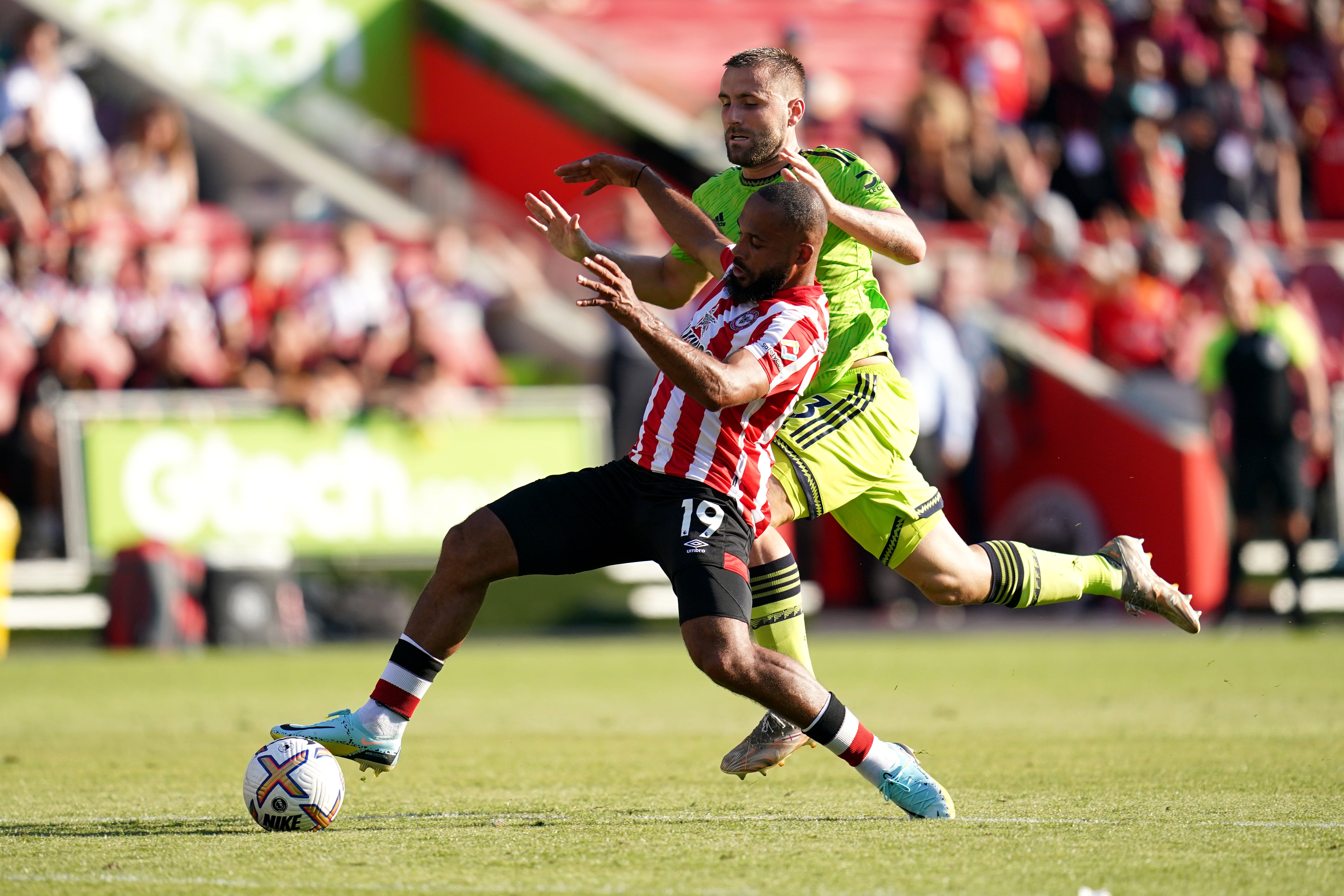 Brentford’s Bryan Mbeumo (left) and Manchester United’s Luke Shaw battle for the ball