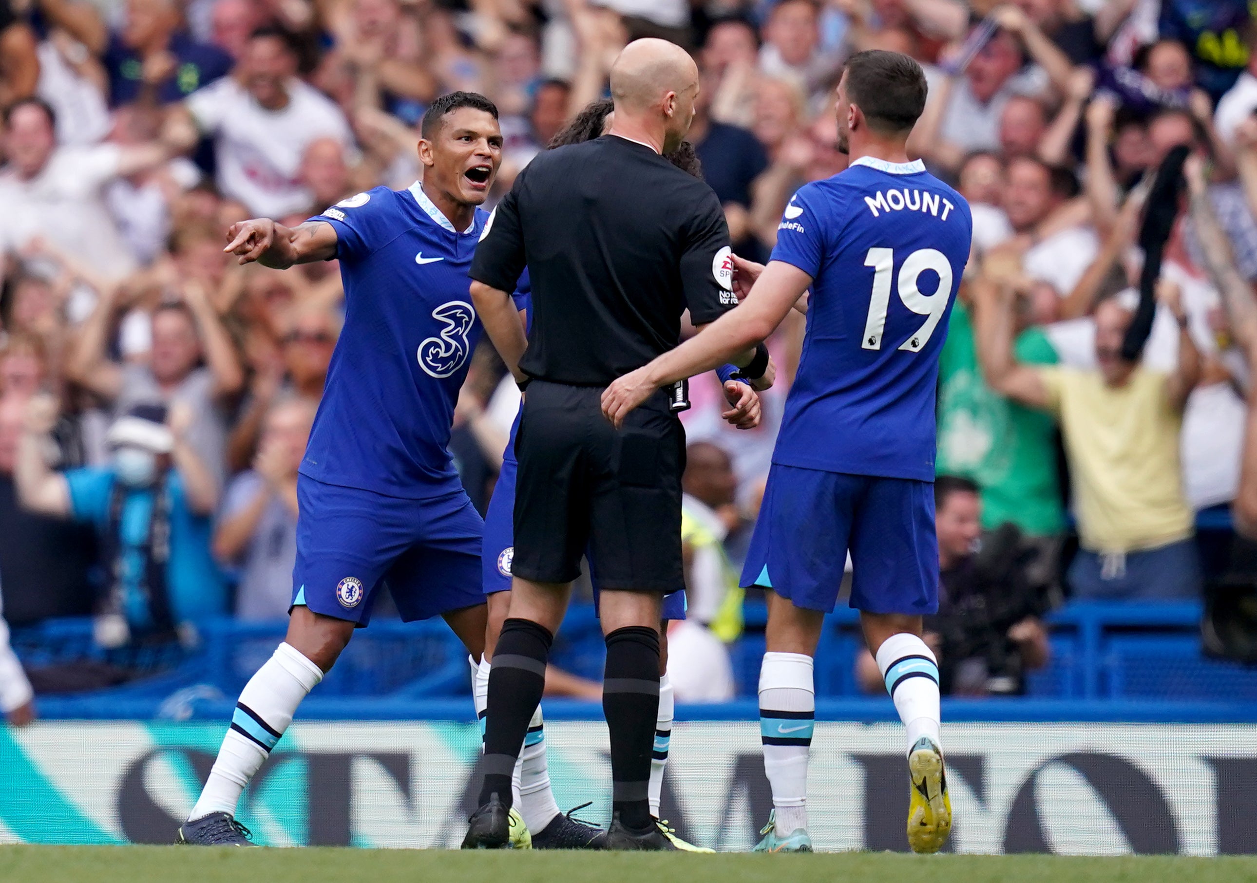 Anthony Taylor, centre, endured a testing time in Chelsea’s 2-2 draw with Tottenham (John Walton/PA)