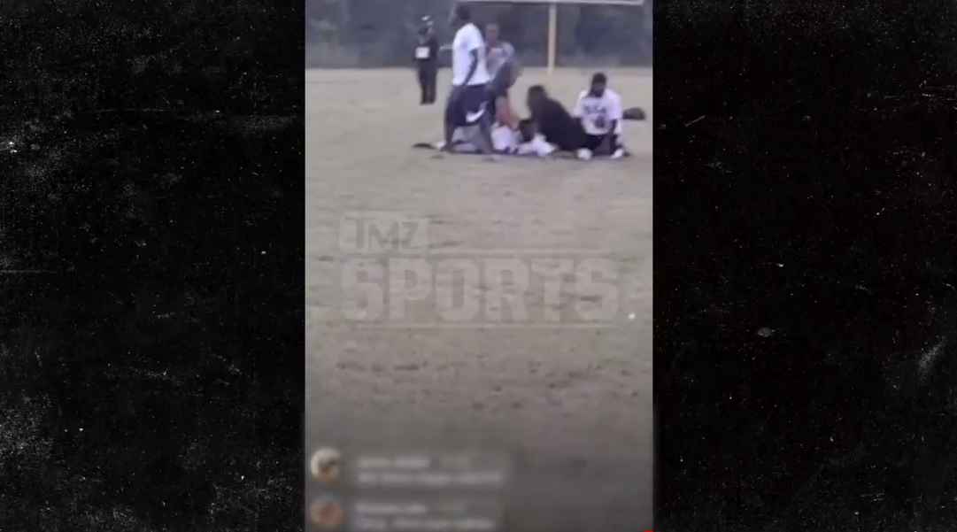 Attendees at a youth football game in Texas can be seen tending to a person who appears to have been hurt after gunshots were fired at a Saturday night game outside of Dallas