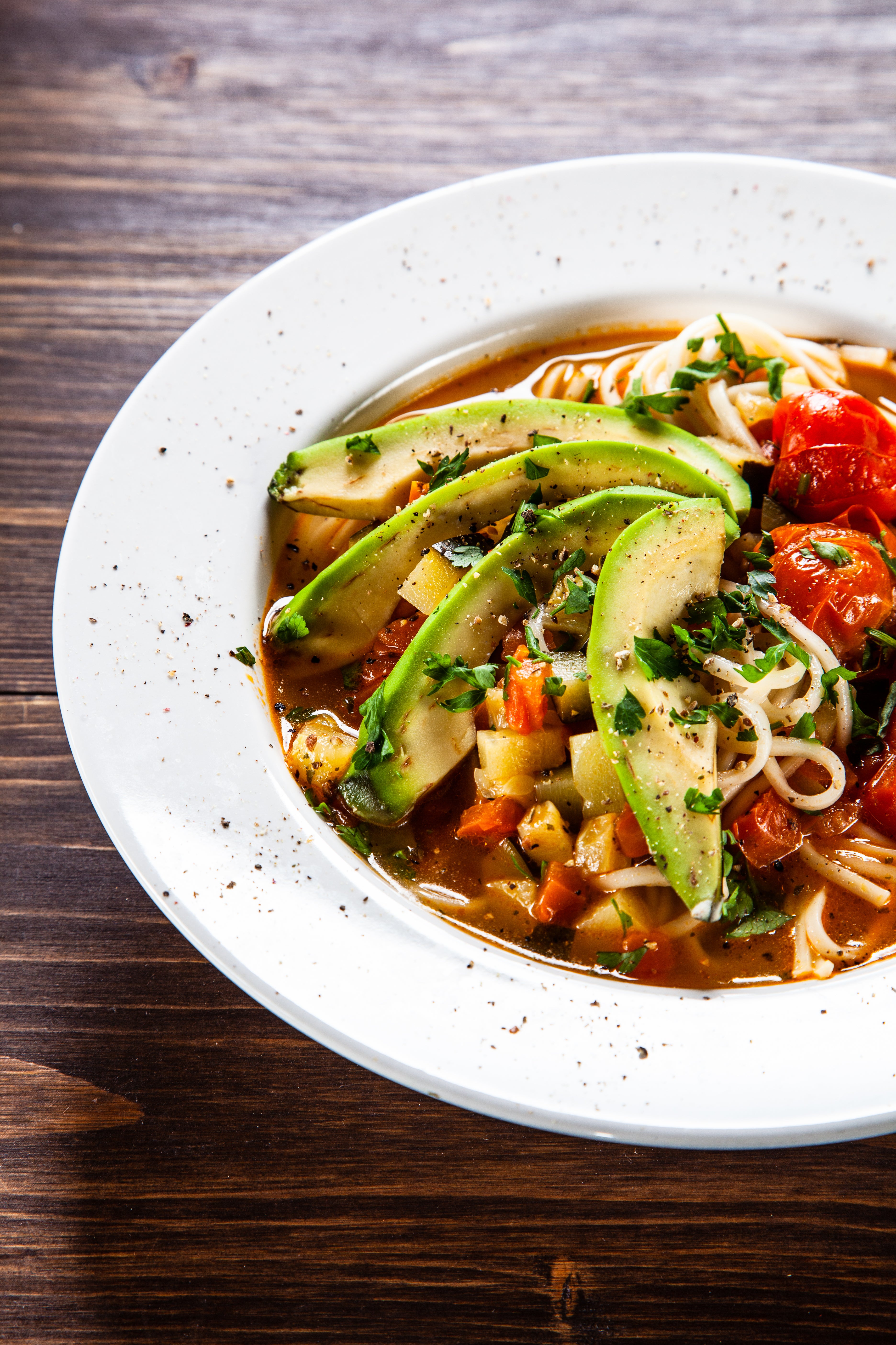 Halved cherry tomatoes provide a strong flavour foundation for this cold noodle dish