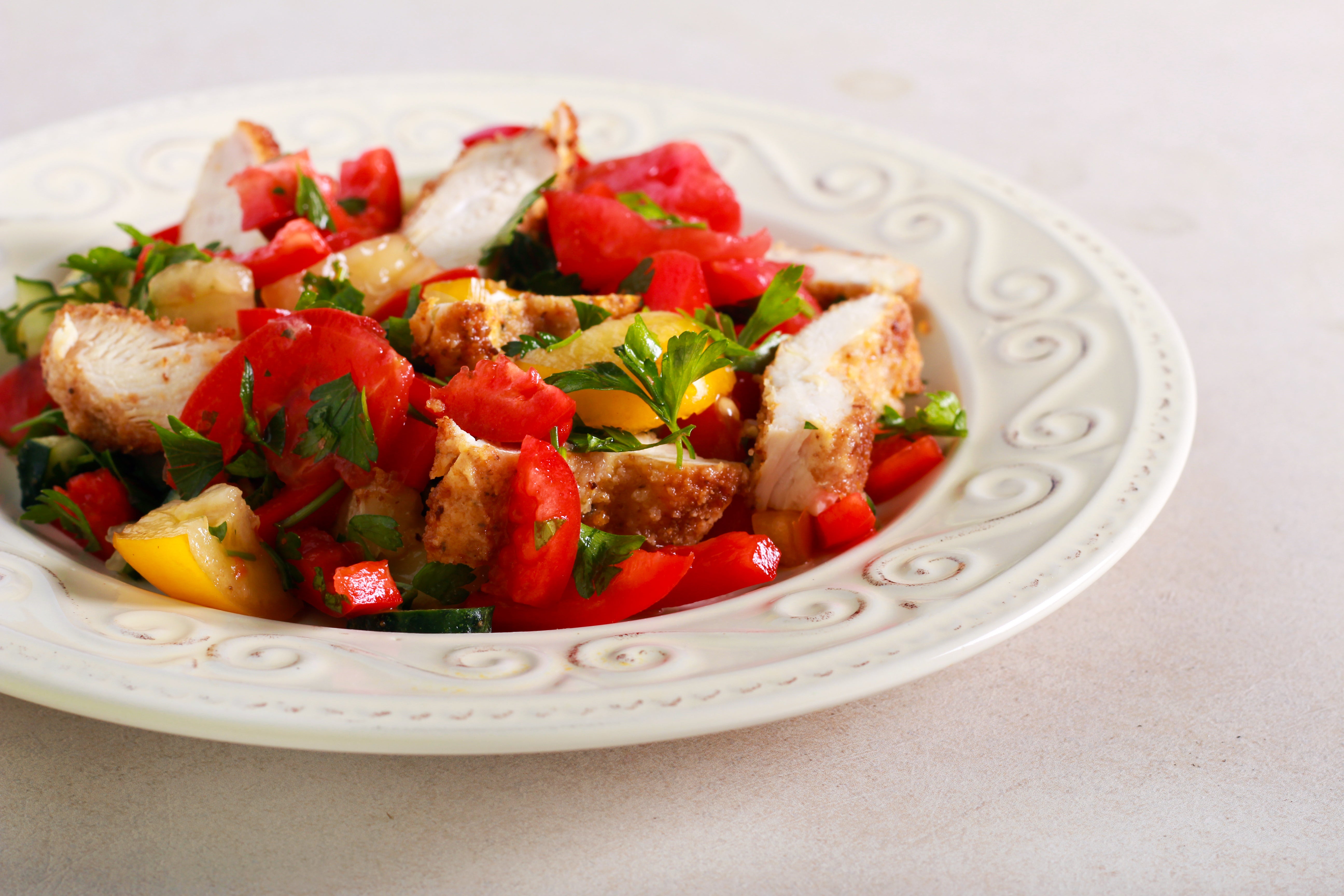 For better weeknight chicken, dredge it in flour loaded with freshly grated parmesan and shallow-fry it