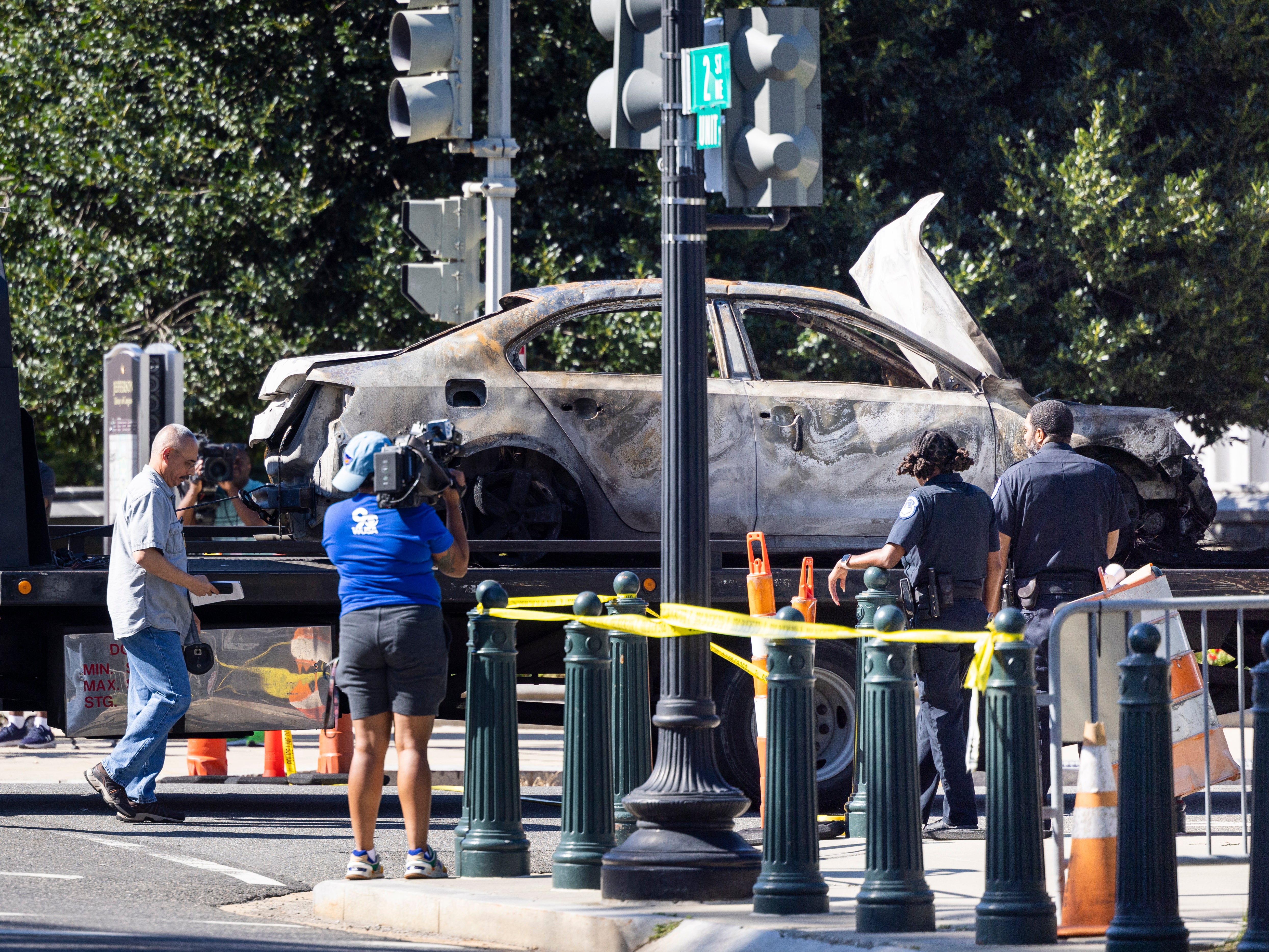 A tow truck removes a car that crashed into a US Capitol barricade in Washington, DC, USA, 14 August 2022