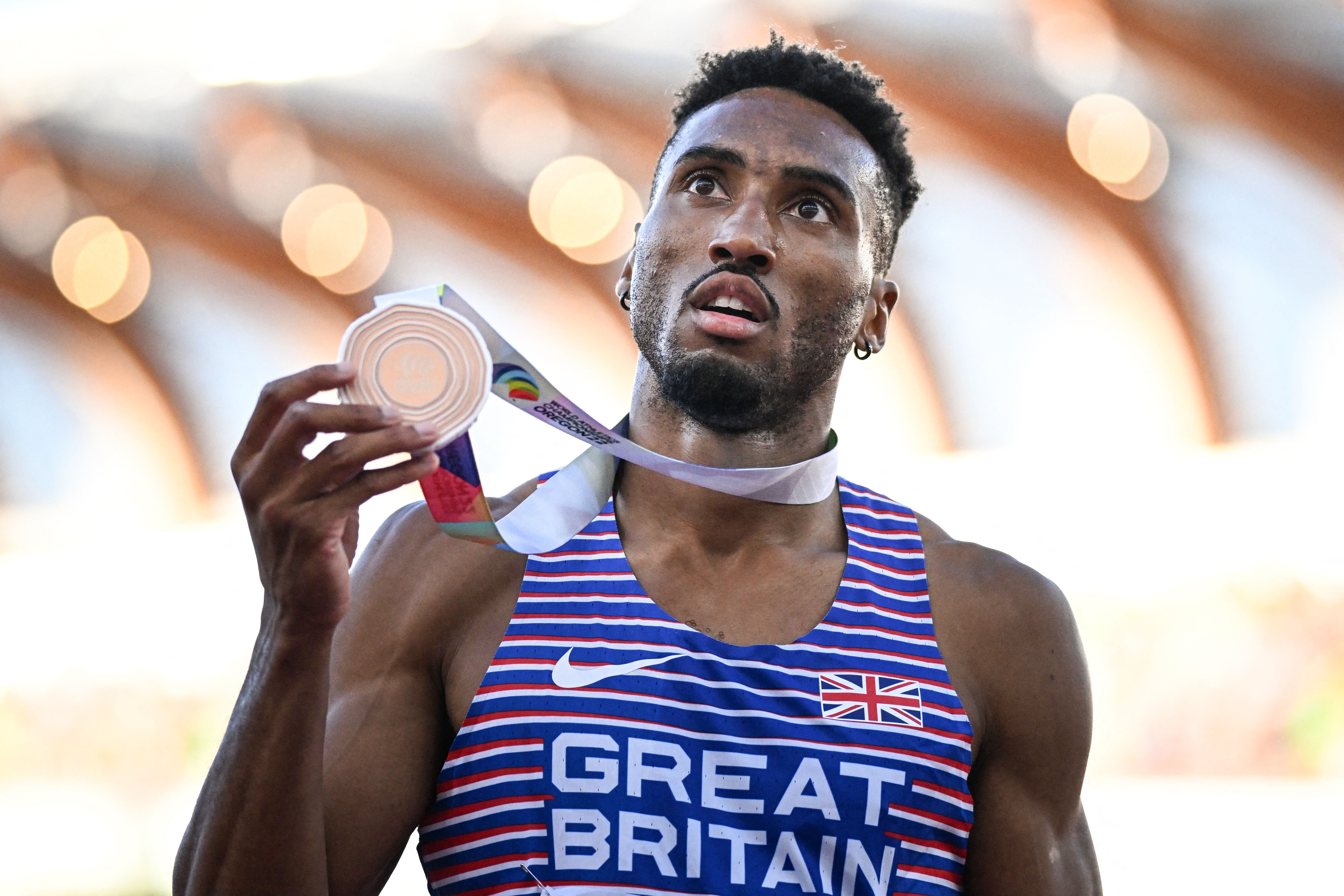 Great Britain’s Matthew Hudson-Smith celebrates with his medal after winning bronze