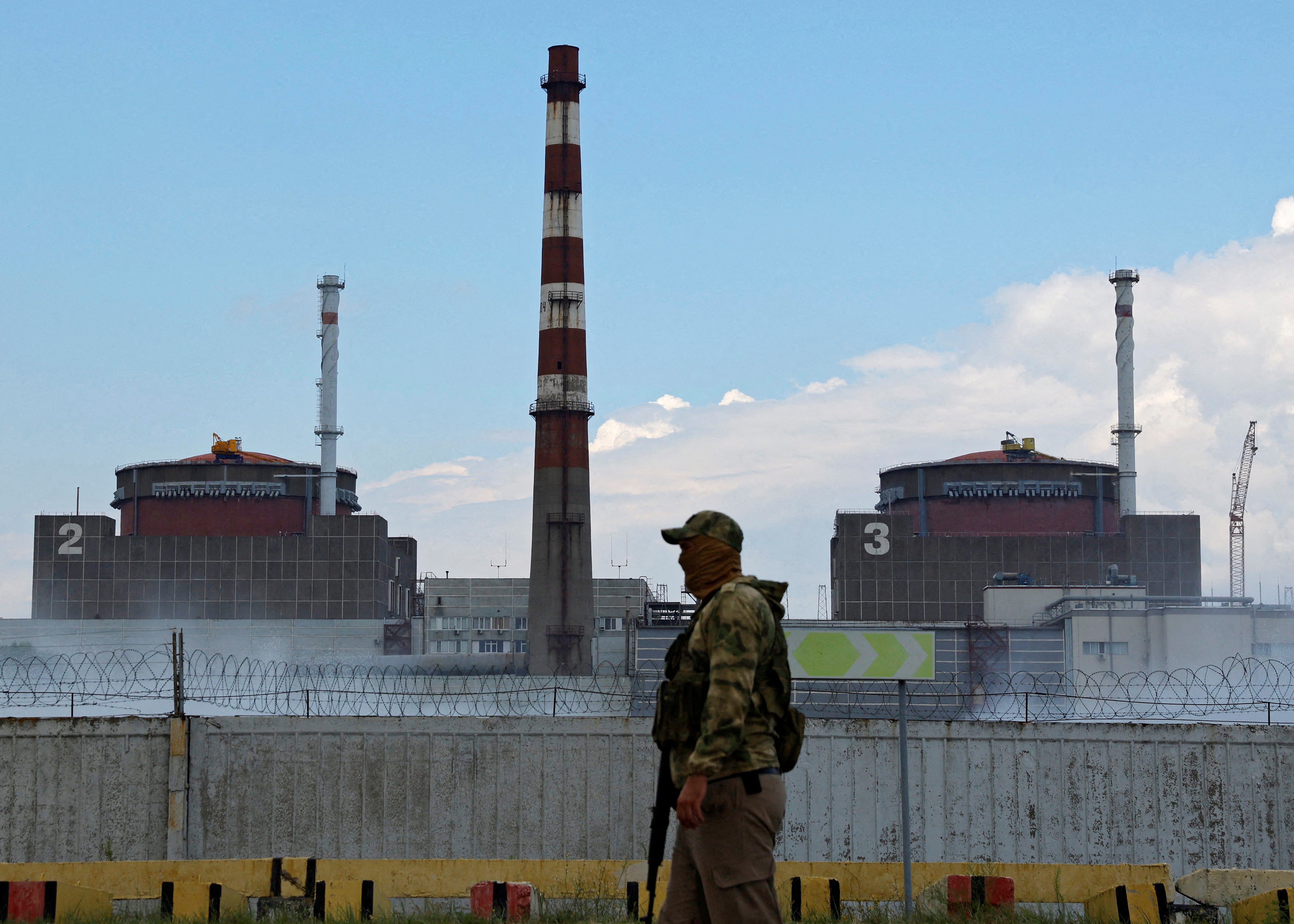 A Russian serviceman stands guard near the Zaporizhzhia nuclear power plant near the city of Enerhodar