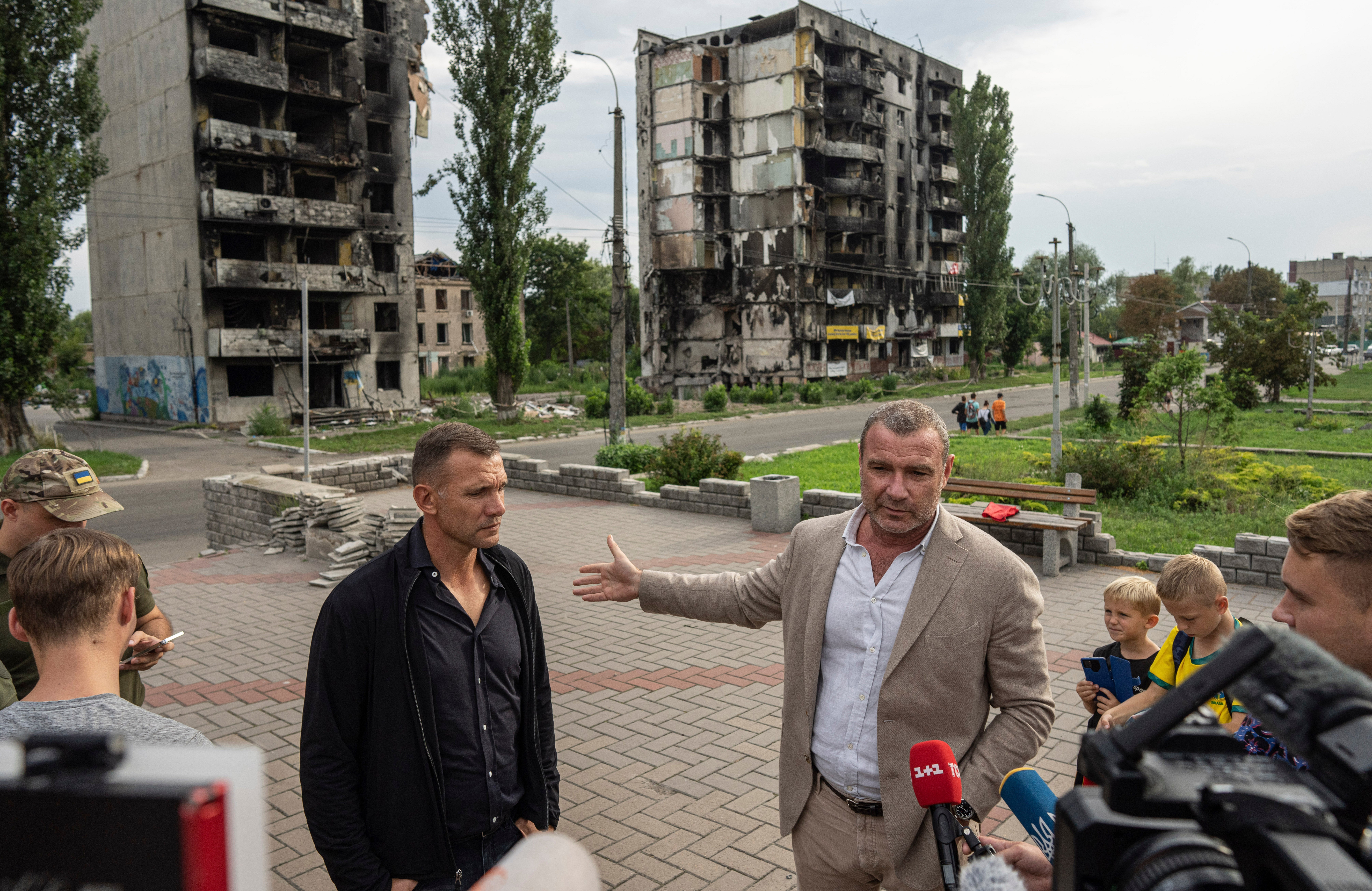 Shevchenko and American actor Liev Schreiber, whose maternal grandfather emigrated from Ukraine, visit the bombed centre of Borodianka, Kyiv Oblast