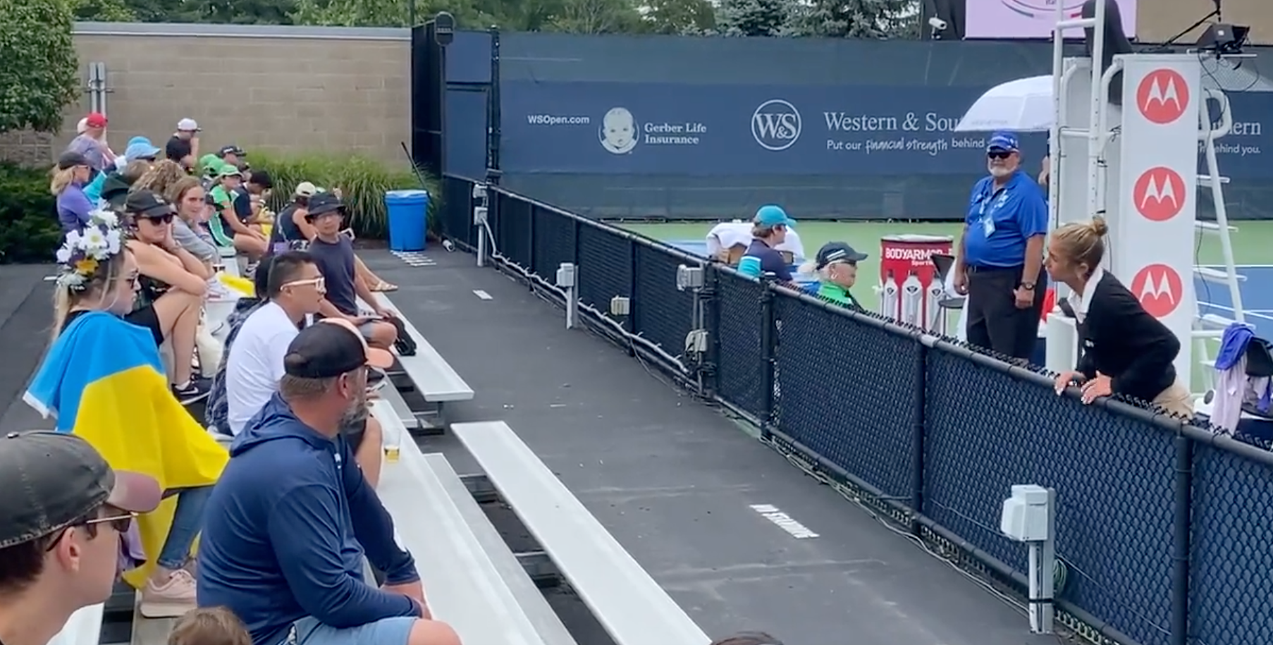 A fan is asked to remove a Ukraine flag at the Western & Southern Open