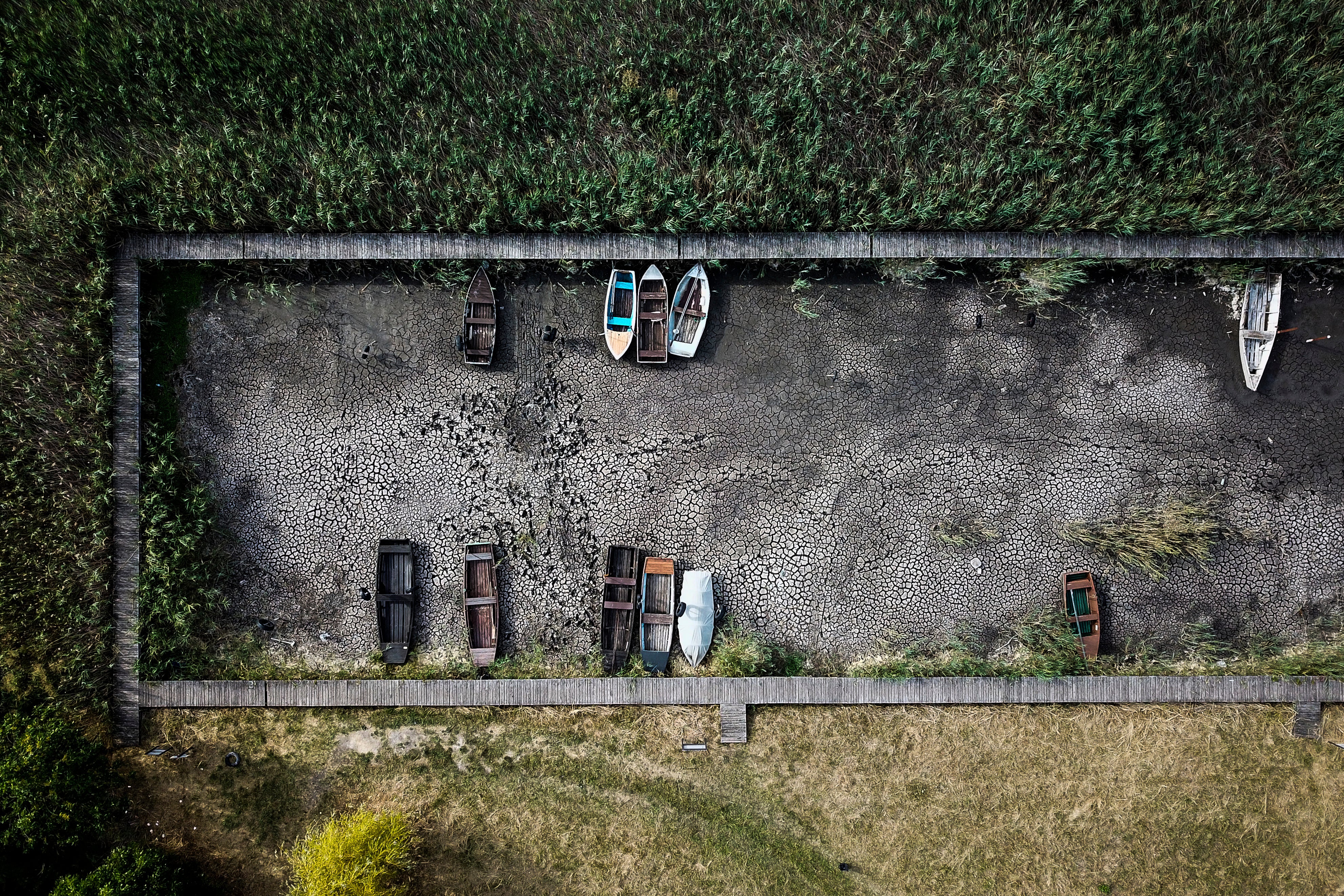 Boats lay on the dried lake bed in a port in Velence, Hungary last week