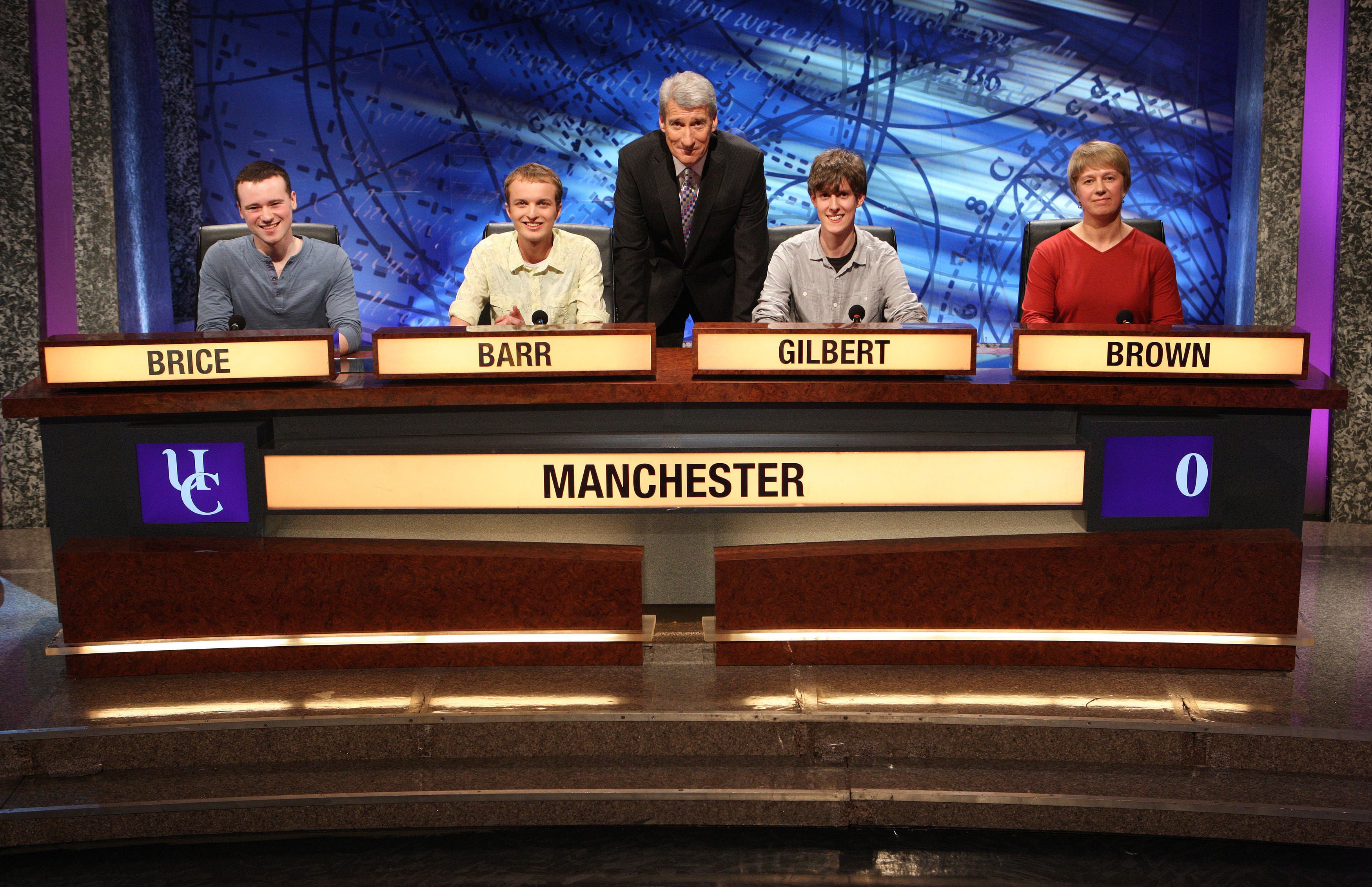 Paxman with a team of student contestants