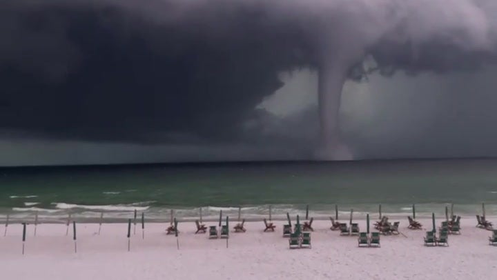 ‘That’s a big ‘un’: Beachgoers marvel at massive waterspout off Florida coast