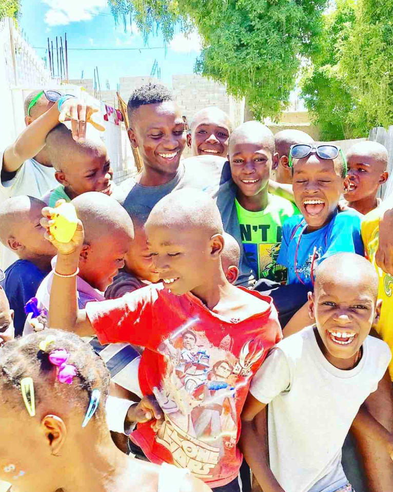 Mr Amisial often volunteers at orphanages in his home country of Haiti