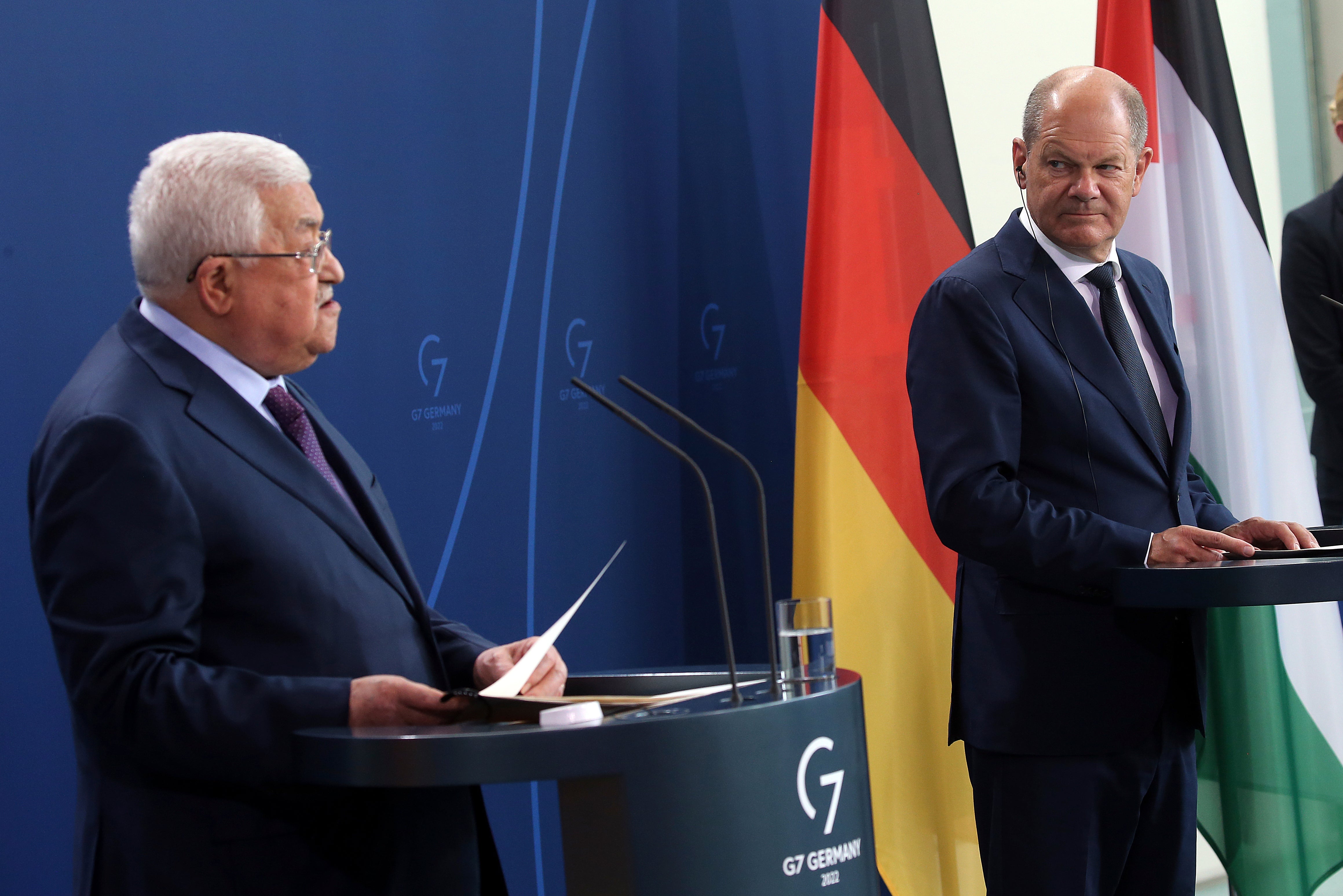 Palestinian president Mahmoud Abbas (left) speaks during a news conference after a meeting with German chancellor Olaf Scholz