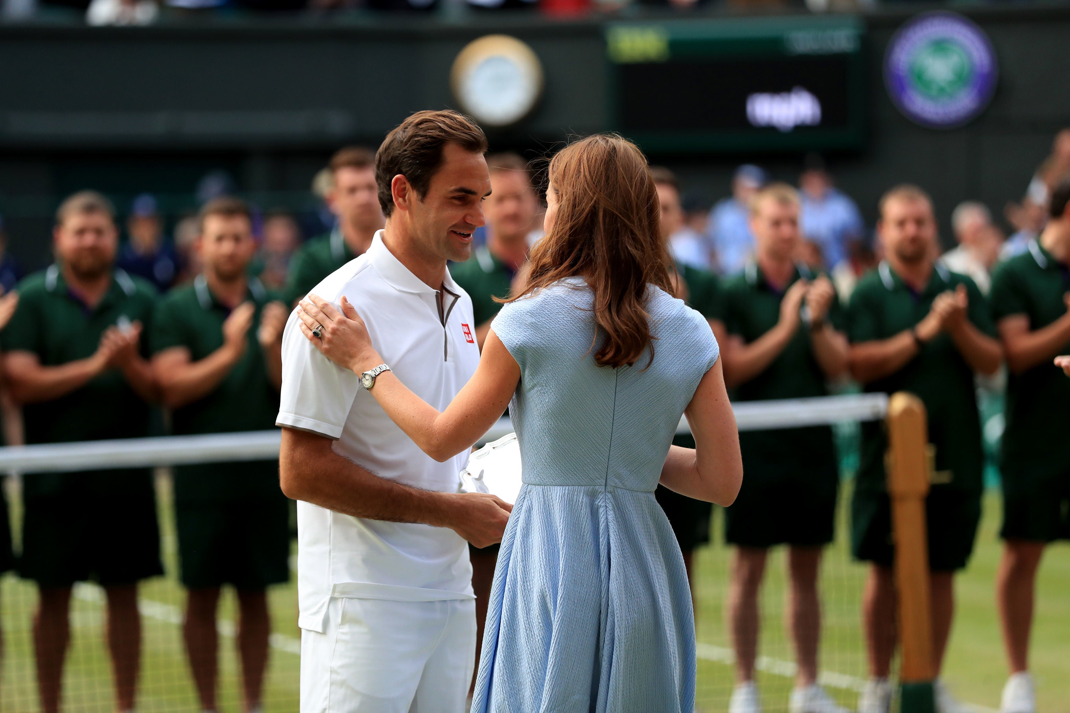 Roger Federer is presented the runners up trophy by the Duchess of Cambridge, 2019