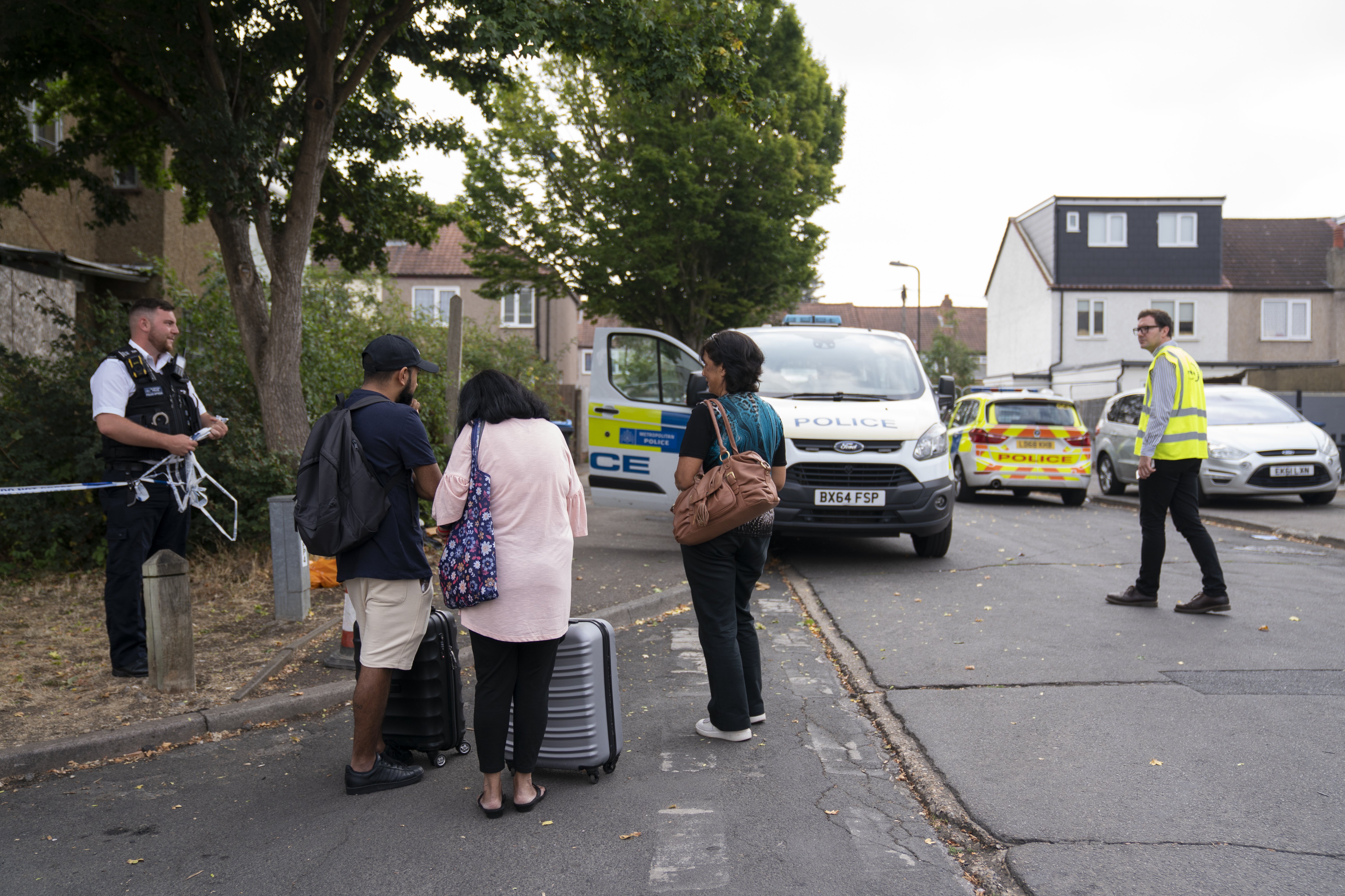 Residents return to their homes in Galpin’s Road (Kirsty O’Connor/PA)