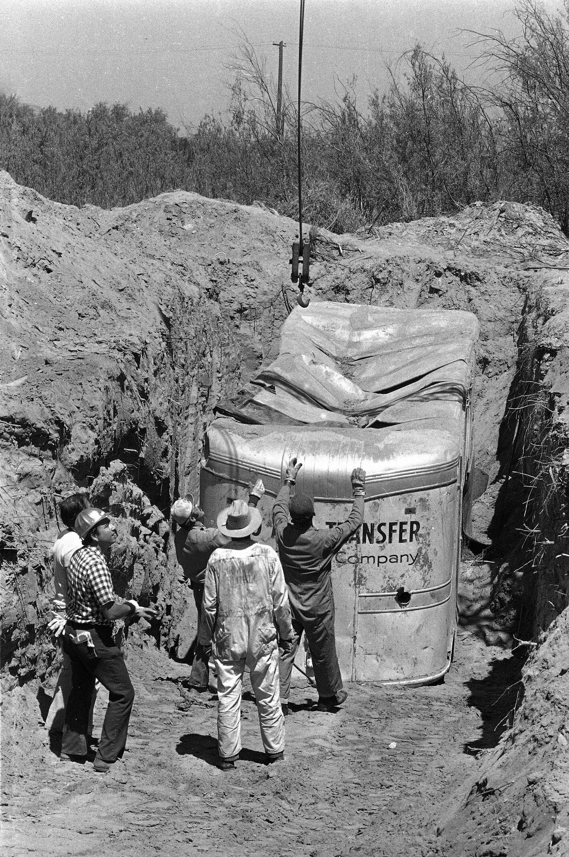 In this July 20, 197 photo, officials remove the moving van buried at a rock quarry in Livermore, California, where hostages had been held