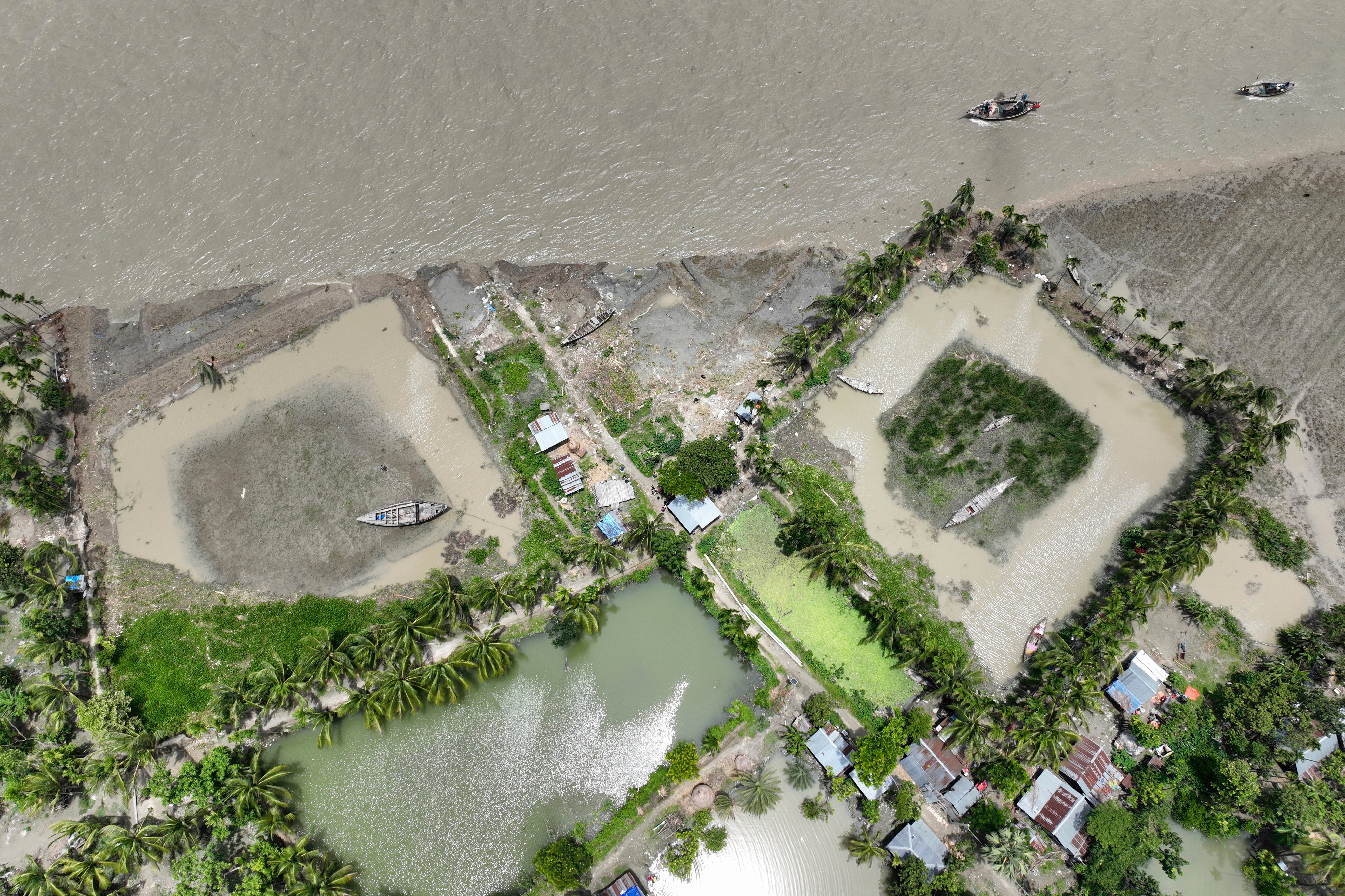 The embankment shows erosion caused by the Meghna River in the Ramdaspur village in the Bhola district of Bangladesh