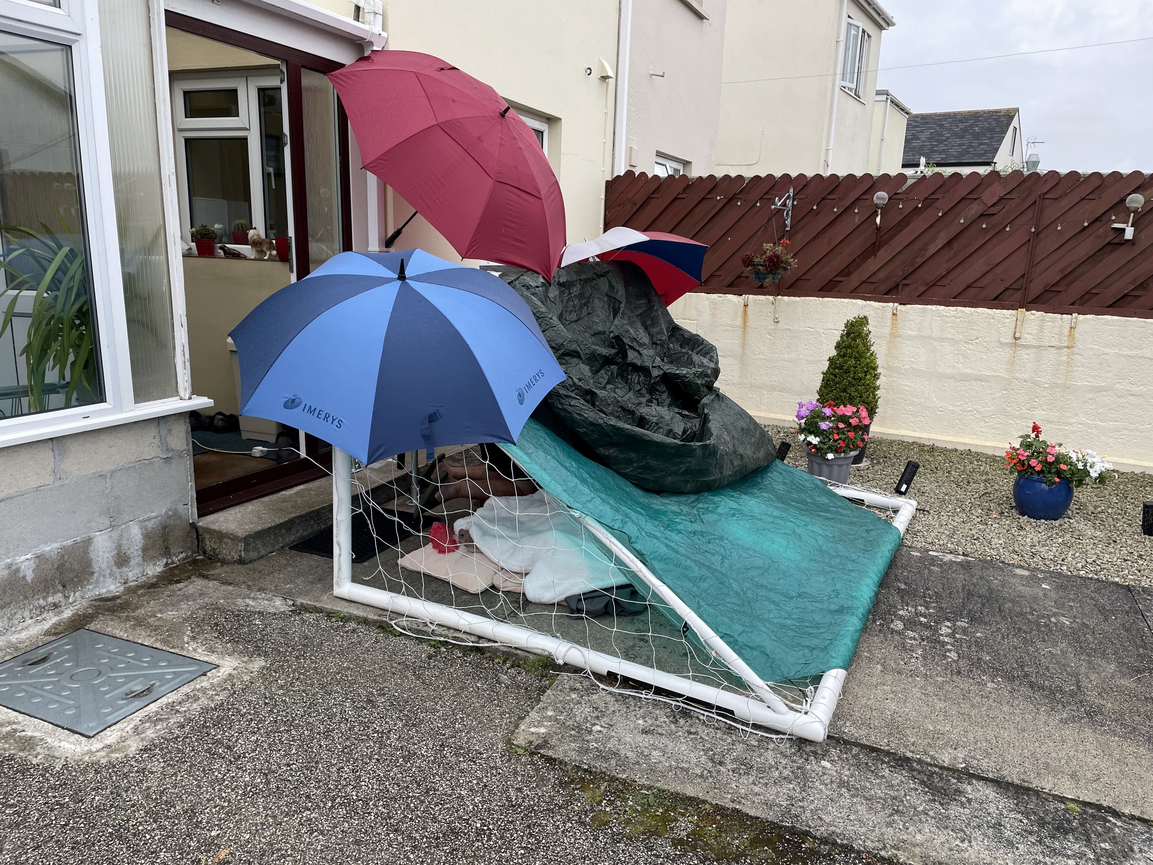 The man’s family were forced to build a shelter to protect him from the rain