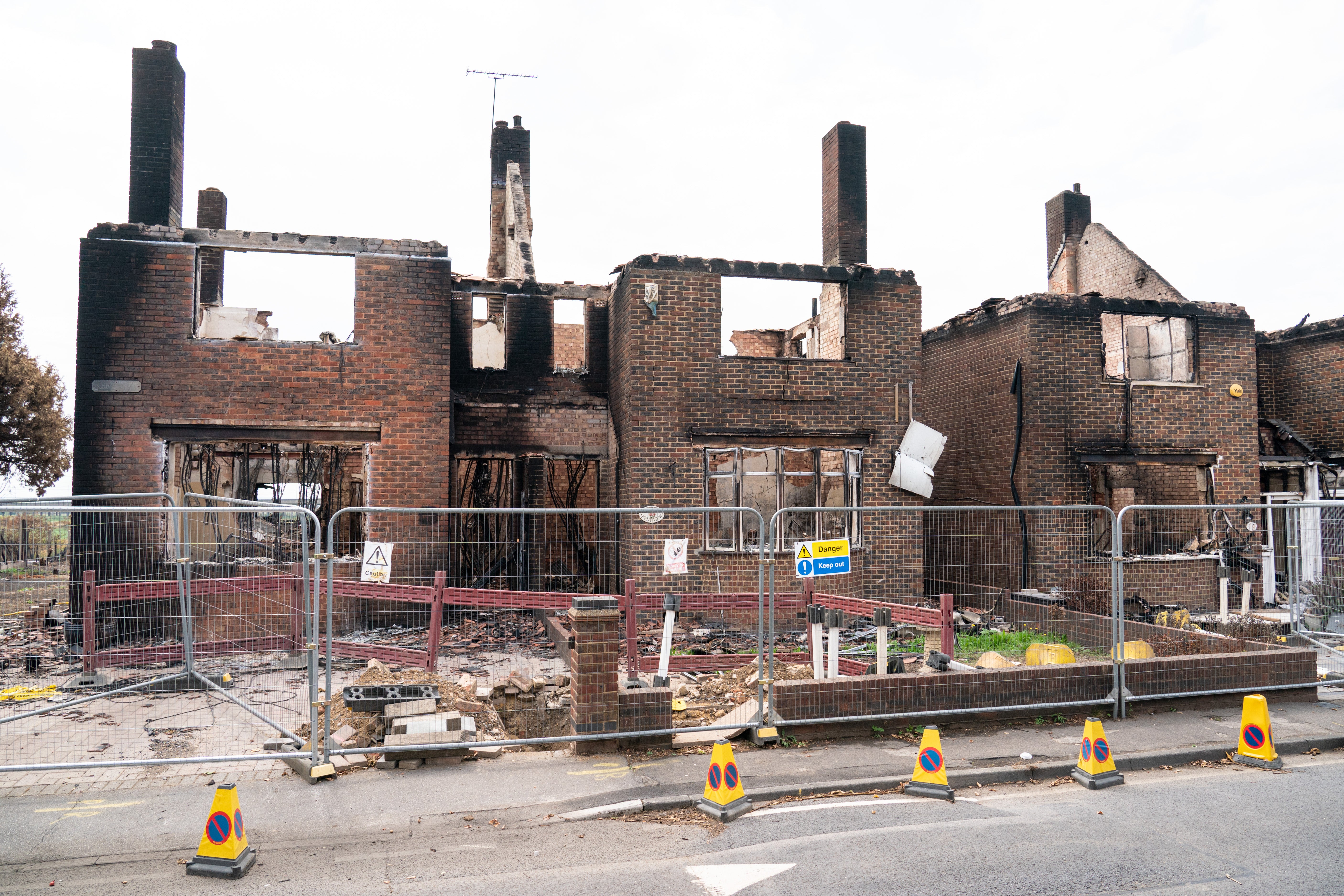 Fire damaged homes in the village of Wennington, in Havering, east London after a blaze on July 19th due to the hot weather. Picture date: Thursday August 18, 2022.