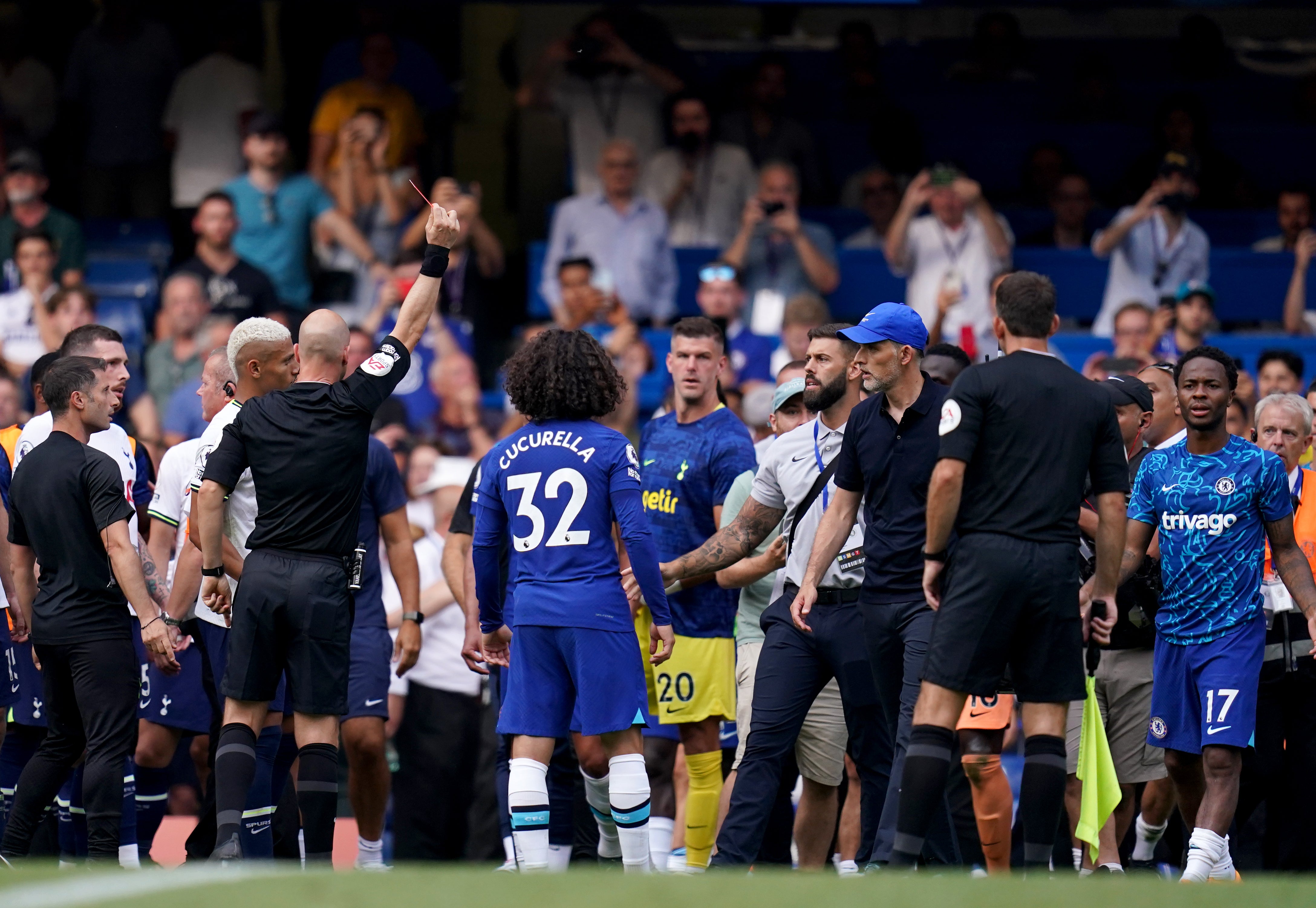 Thomas Tuchel, right of centre, is pulled back from confrontation with Antonio Conte after Chelsea’s 2-2 draw with Tottenham