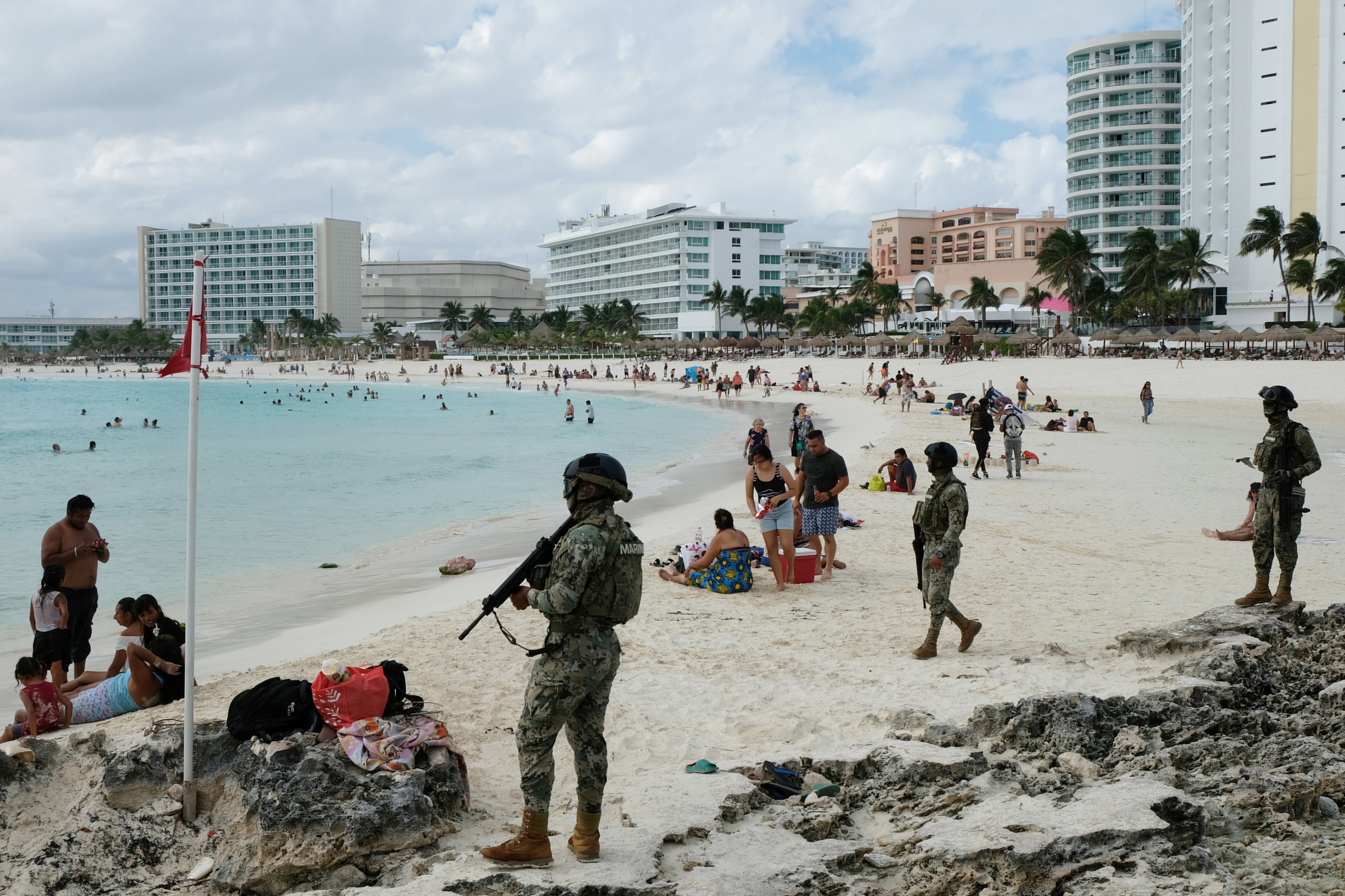 Members of the Navy patrol a beach resort as part of the vacation security in the tourist zone in Cancun by the government of Quintana Roo