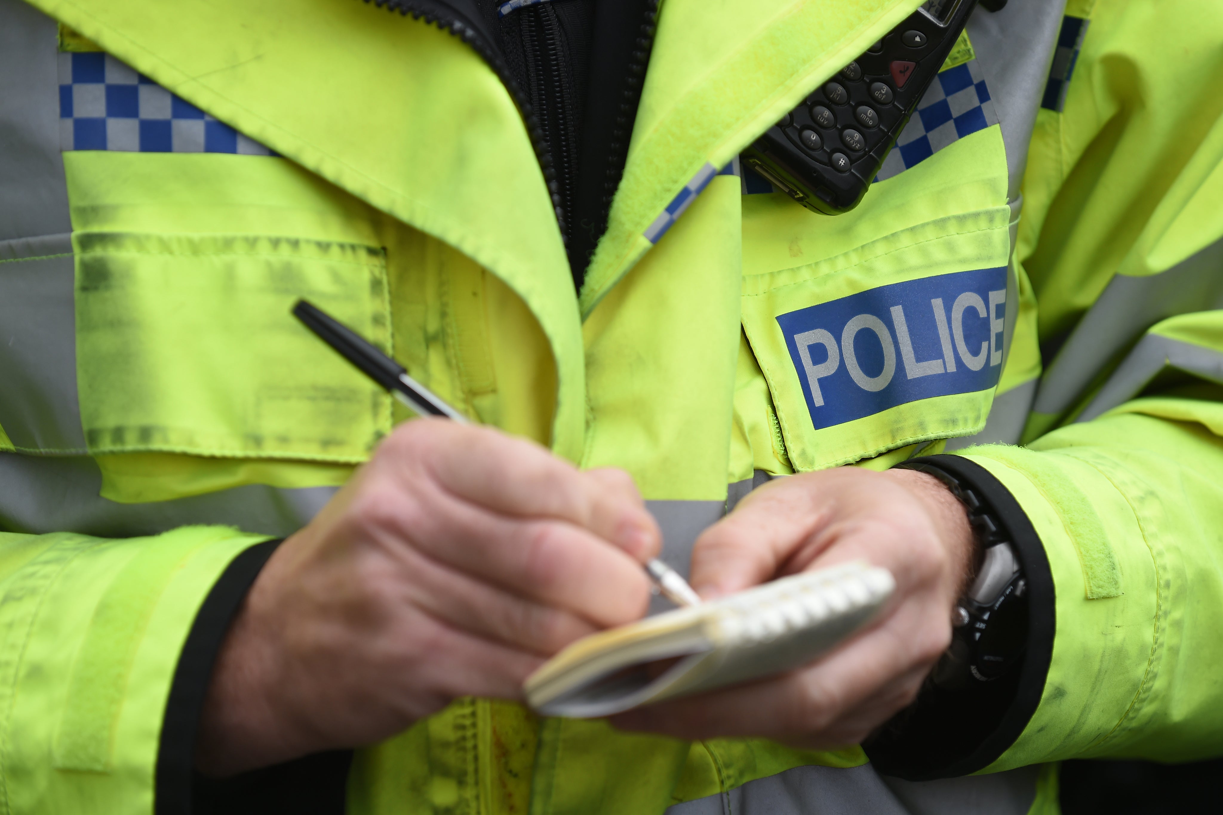 File photo dated 22/10/14 of a police officer writing on paper. (Joe Giddens/PA)