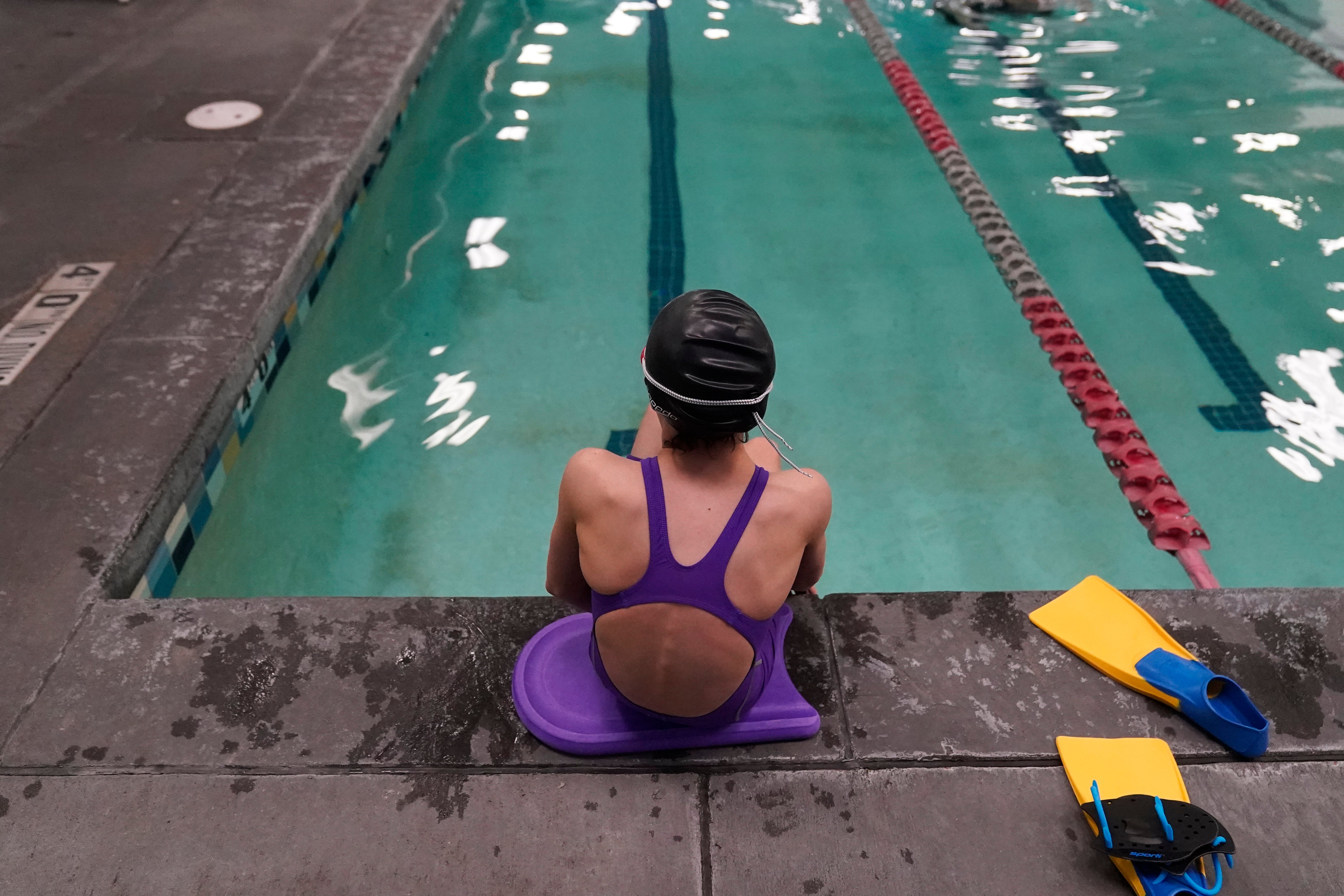 A 12-year-old transgender swimmer in Utah is pictured in February 2021. A state law blocking trans girls from joining girls sports was blocked by a state court on 19 August, 2022.