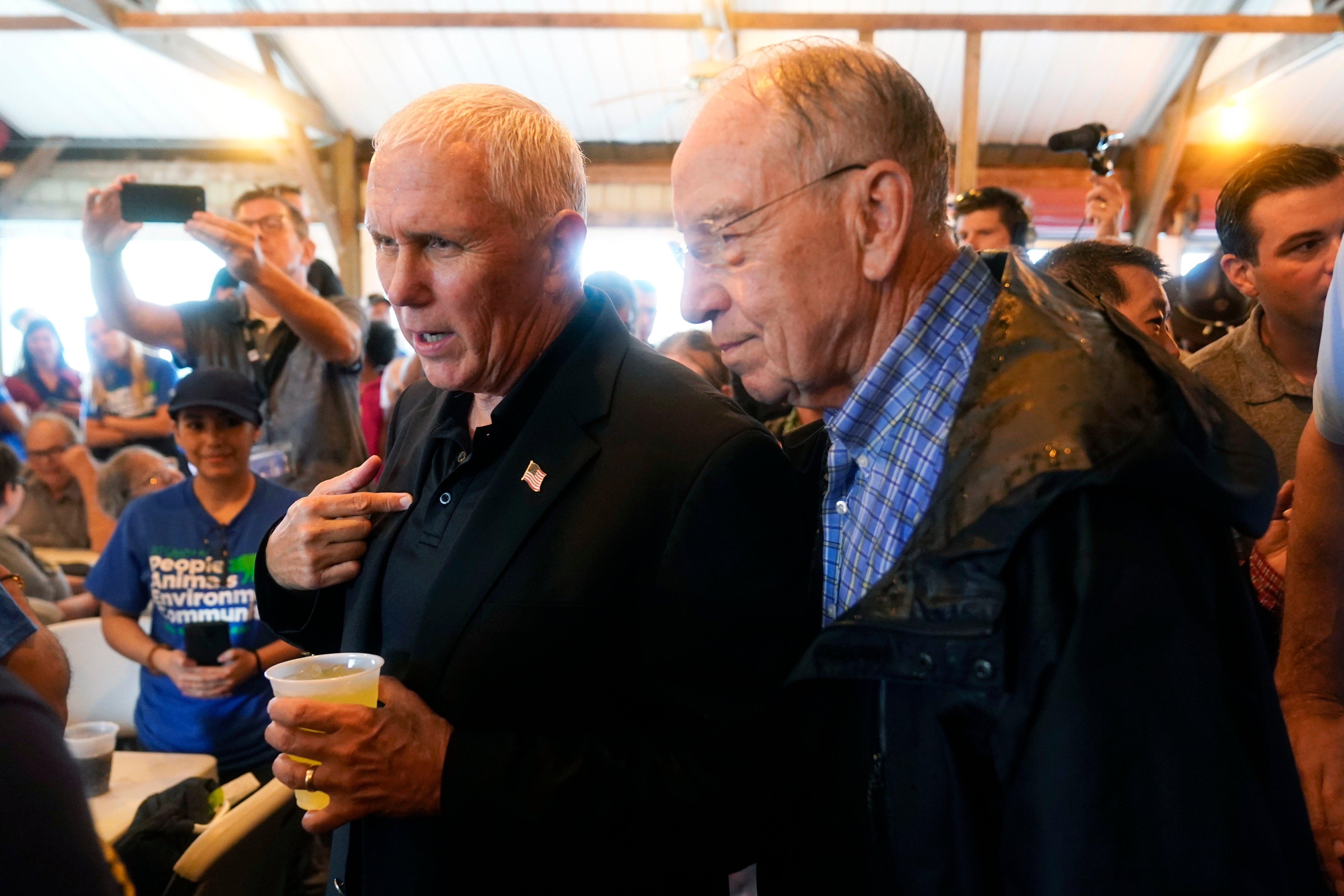 Mr Pence talks with Sen Chuck Grassley during a visit to the Iowa State Fair on Friday