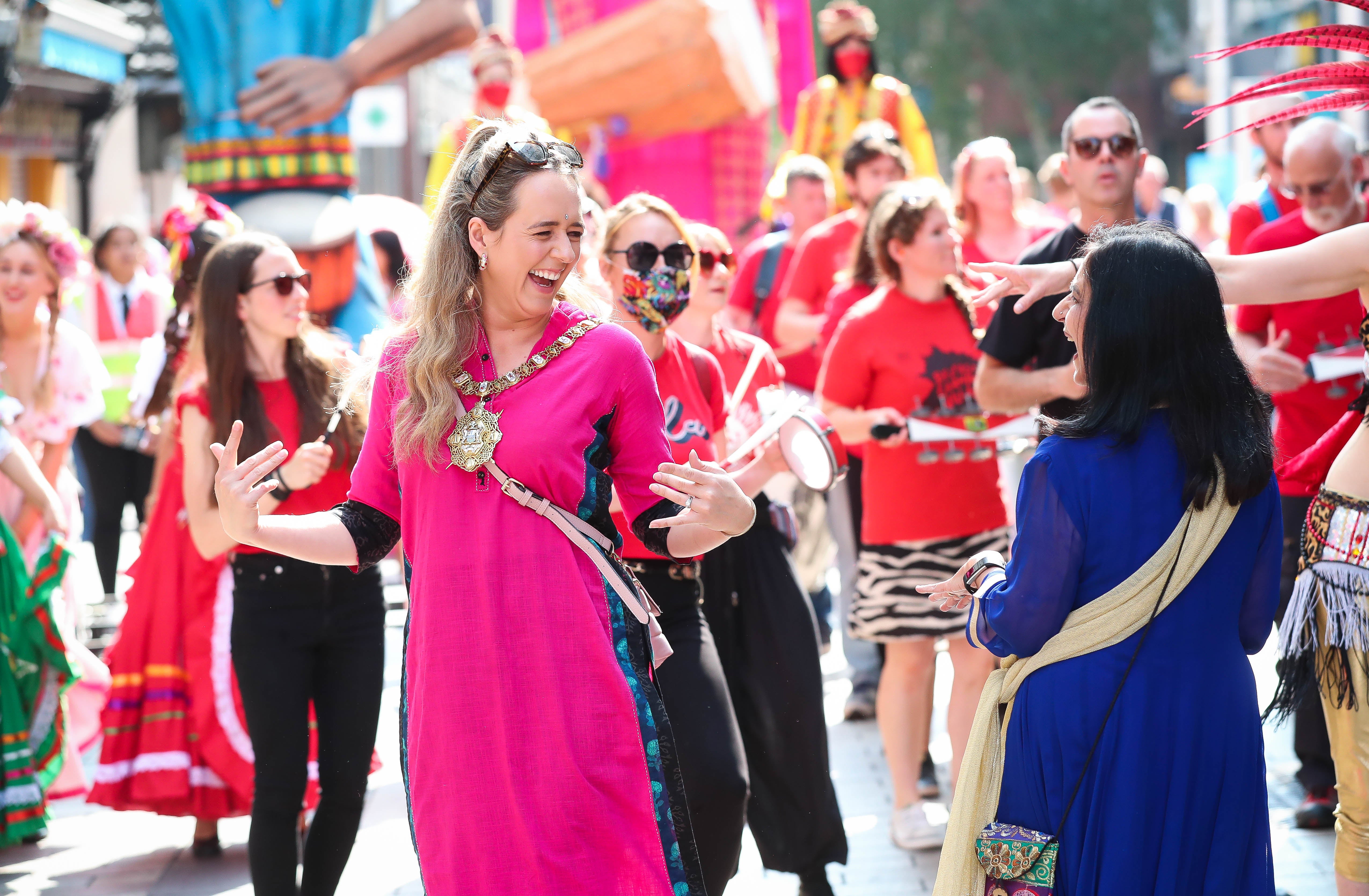 Lord Mayor Kate Nicholl and Nisha Tandon taking part in the Mela annual procession (Kelvin Boyes/Press Eye)