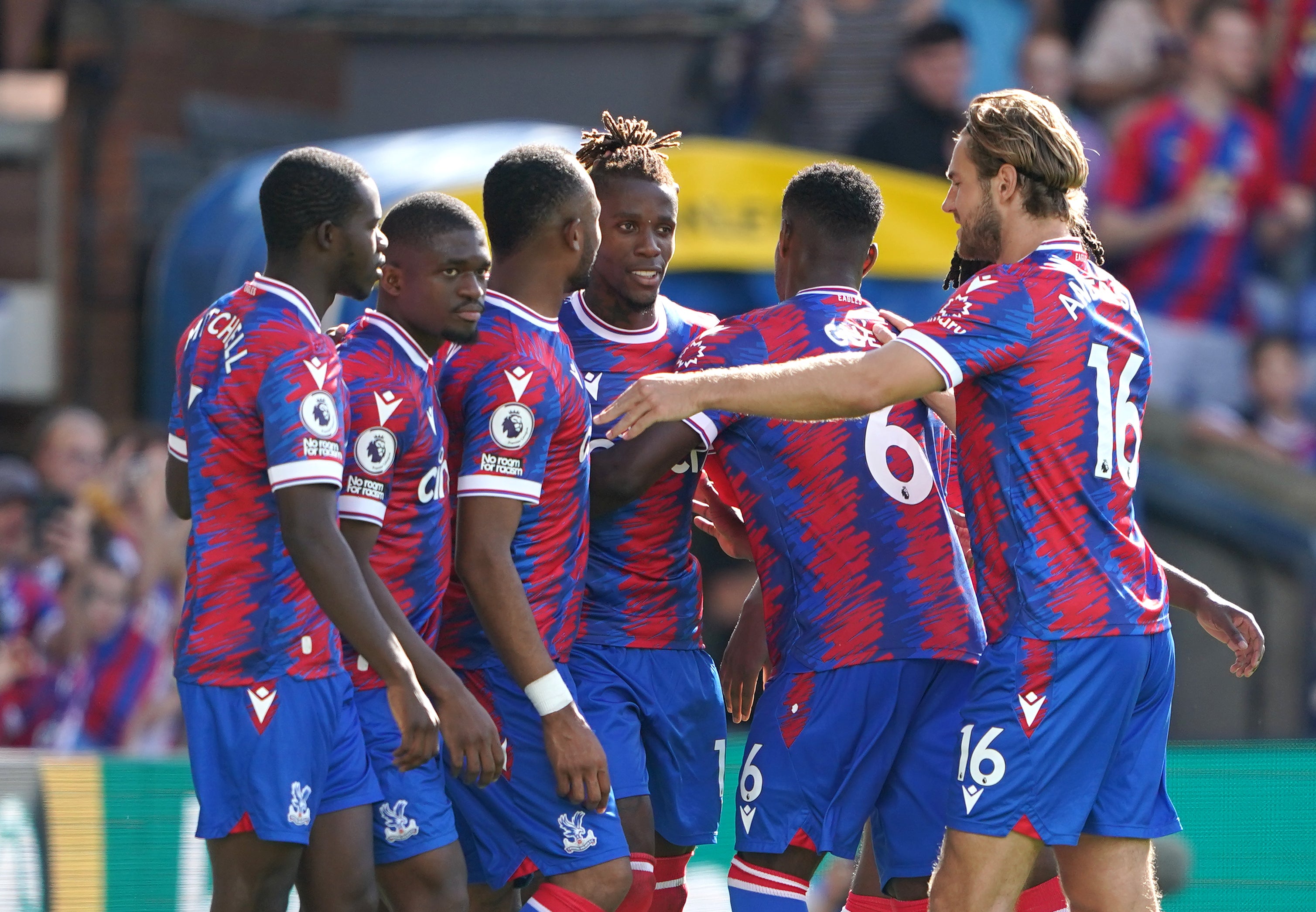 Wilfried Zaha, centre, celebrates his second goal (Zac Goodwin/PA)