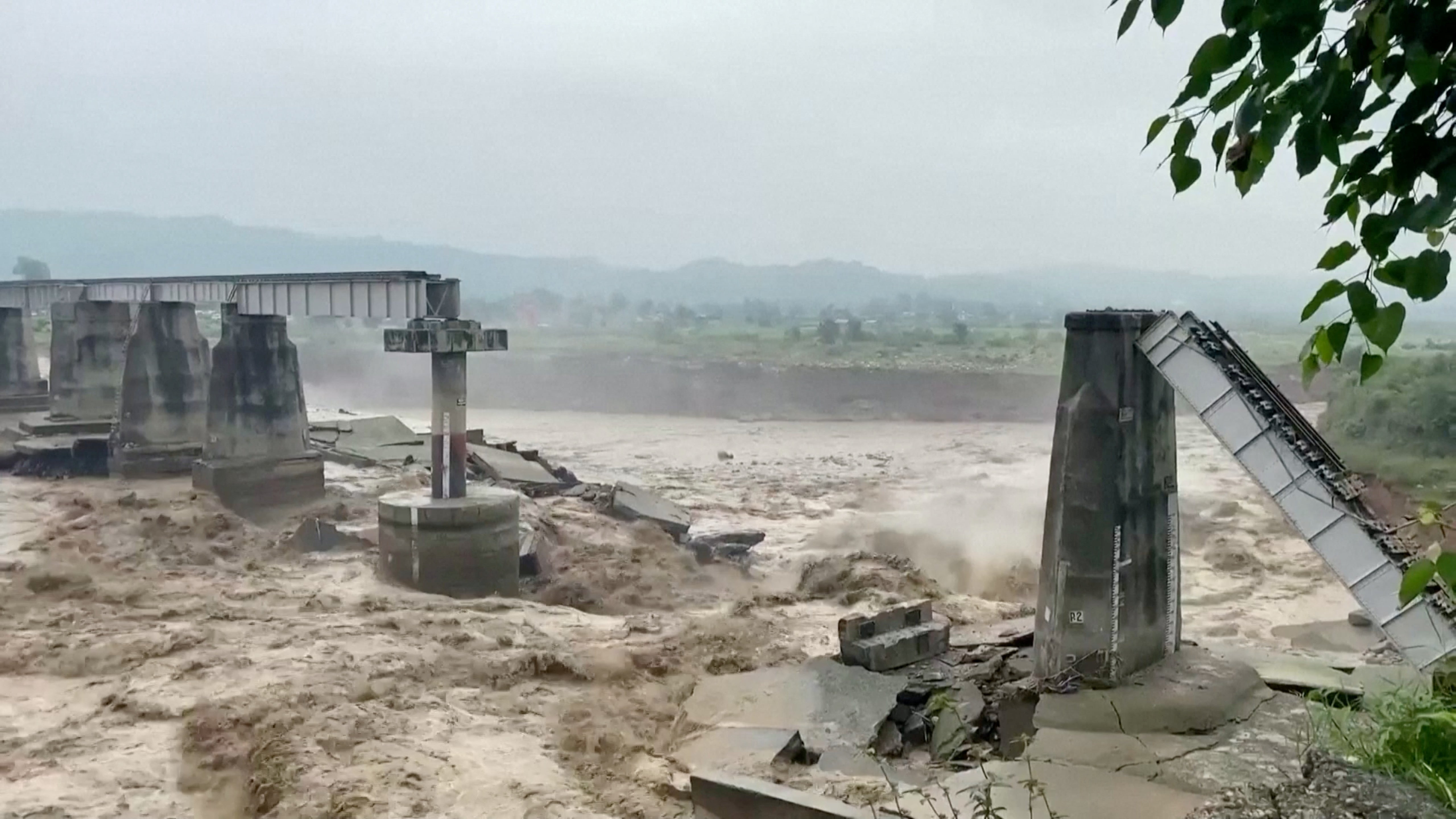 A bridge that collapsed following heavy rain in Kangra, Himachal Pradesh