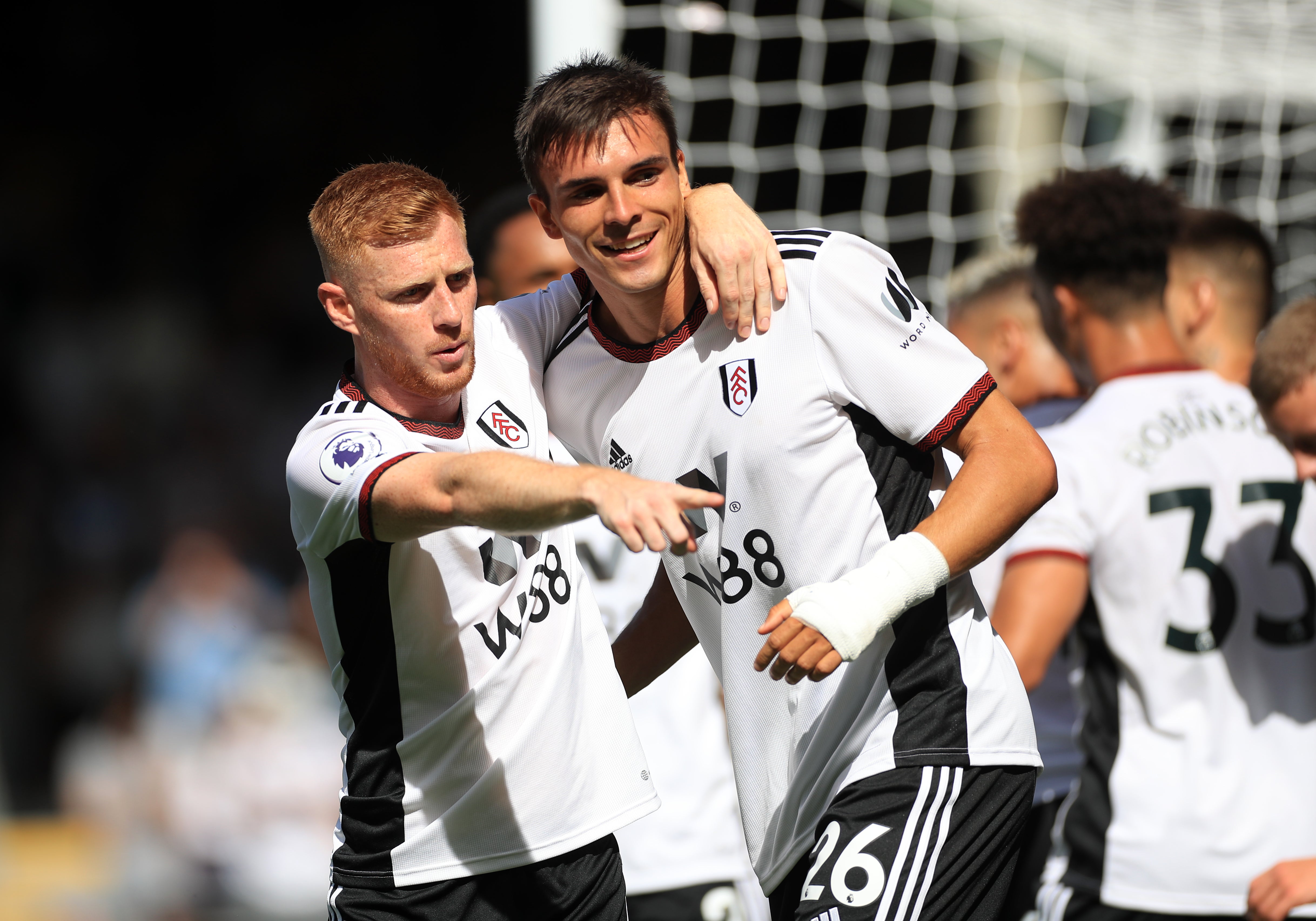 Joao Palhinha, right, celebrates scoring his first goal for Fulham in the 3-2 win over Brentford (Bradley Collyer/PA)