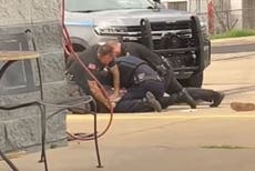 Three Arkansas police officers suspended after viral video shows them pounding man’s head into concrete