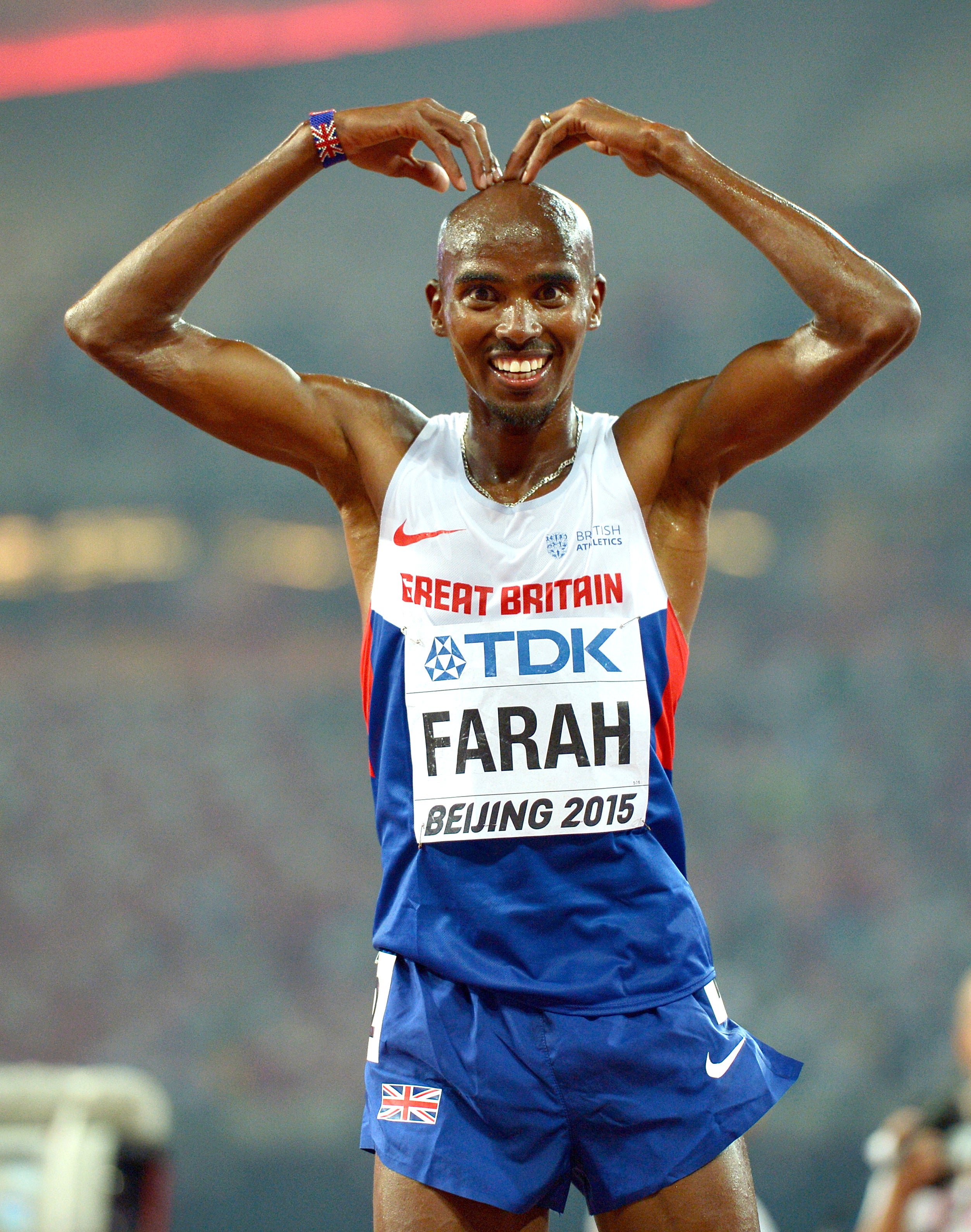 Mo Farah celebrates after winning gold in the 10,000 metres during the 2015 World Championships in Beijing (Adam Davy/PA)