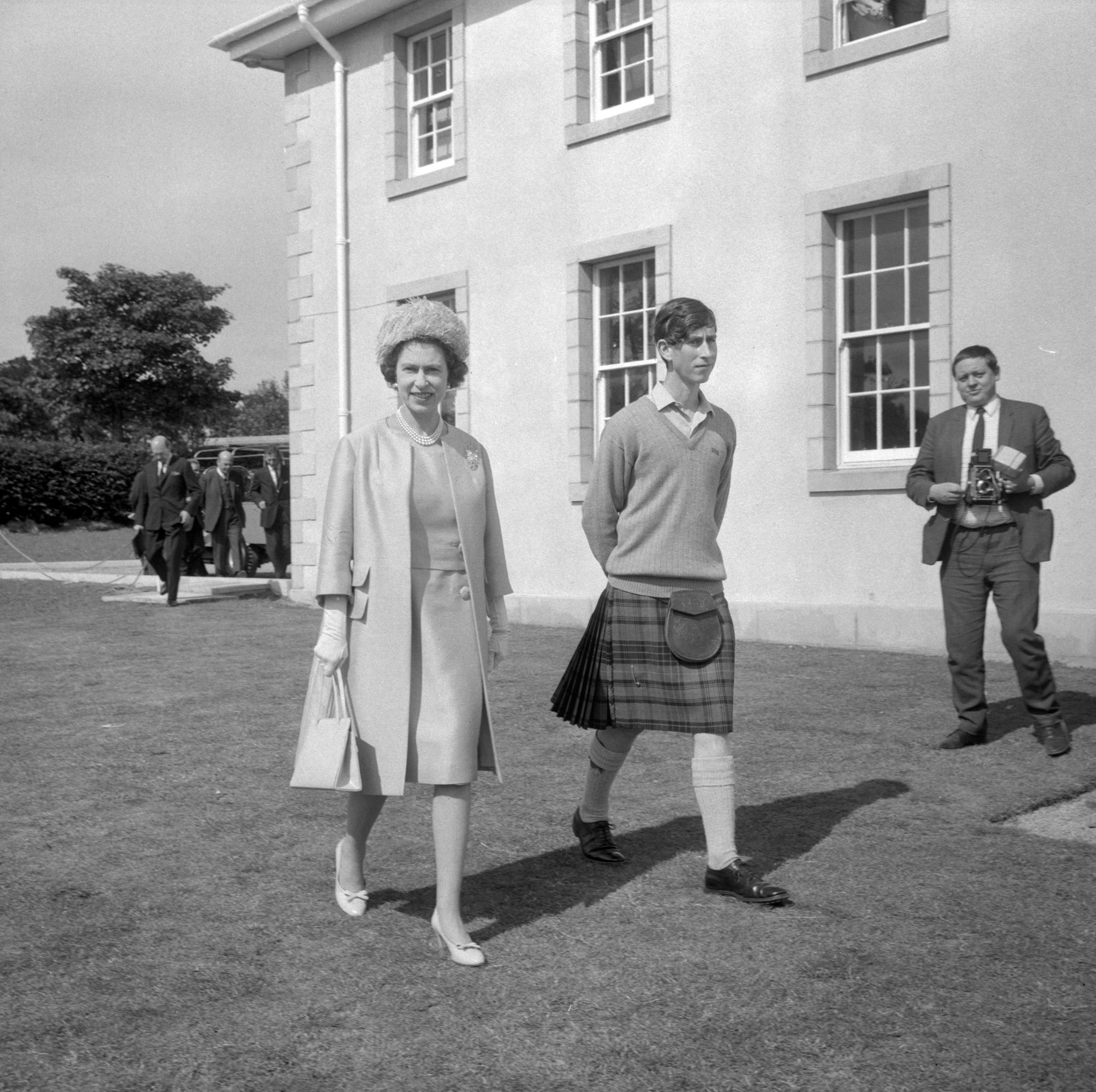 The Queen at Gordonstoun School to open the new sports centre, accompanied by her son the Prince of Wales who was the school’s head boy (PA)