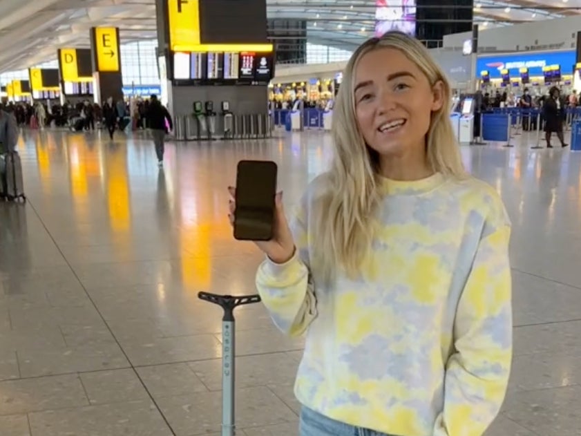 Travel content creator Jade demonstrates the iPhone travel hack on TikTok