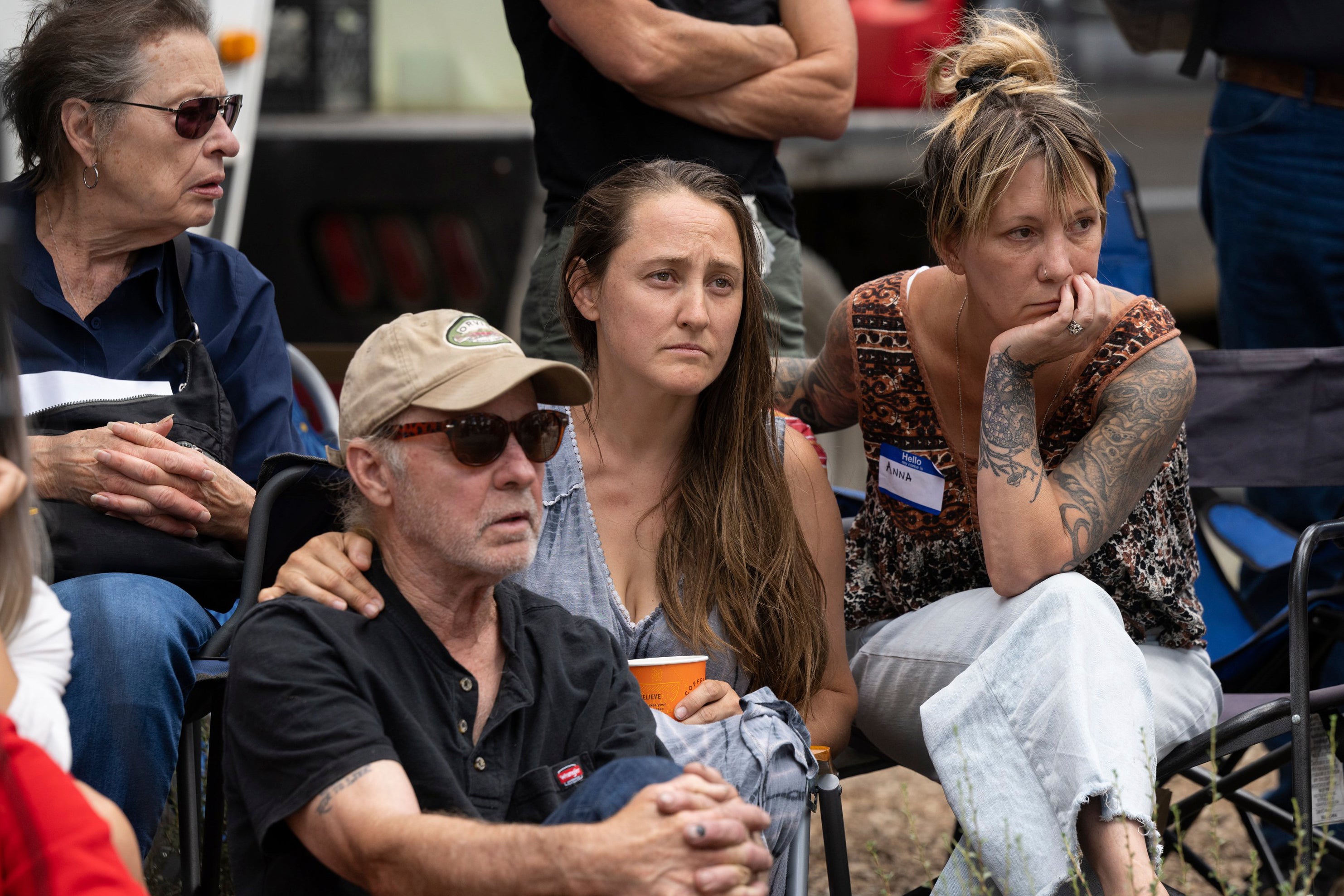 Lindsay Rodni-Nieman and family listen to search commands before a body believed to belong to her daughter was pulled from the water on Sunday