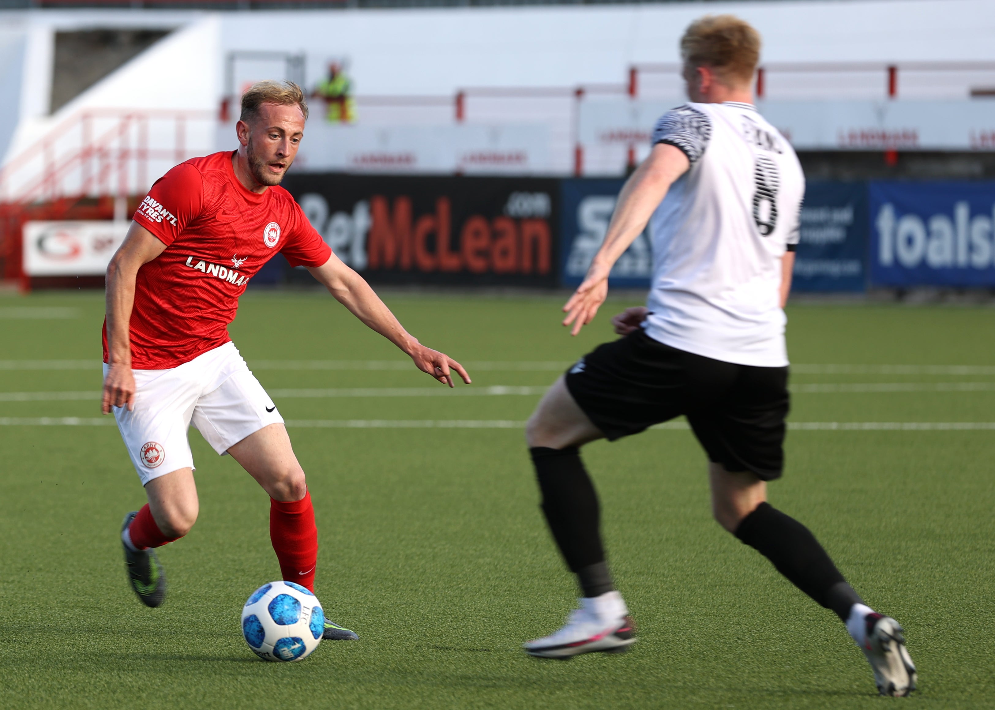 John Herron (left) has left Larne Football Club ‘by mutual consent’ after a photograph emerged of him wearing a T-shirt bearing the slog ‘Up The Ra’ earlier this month (PA)