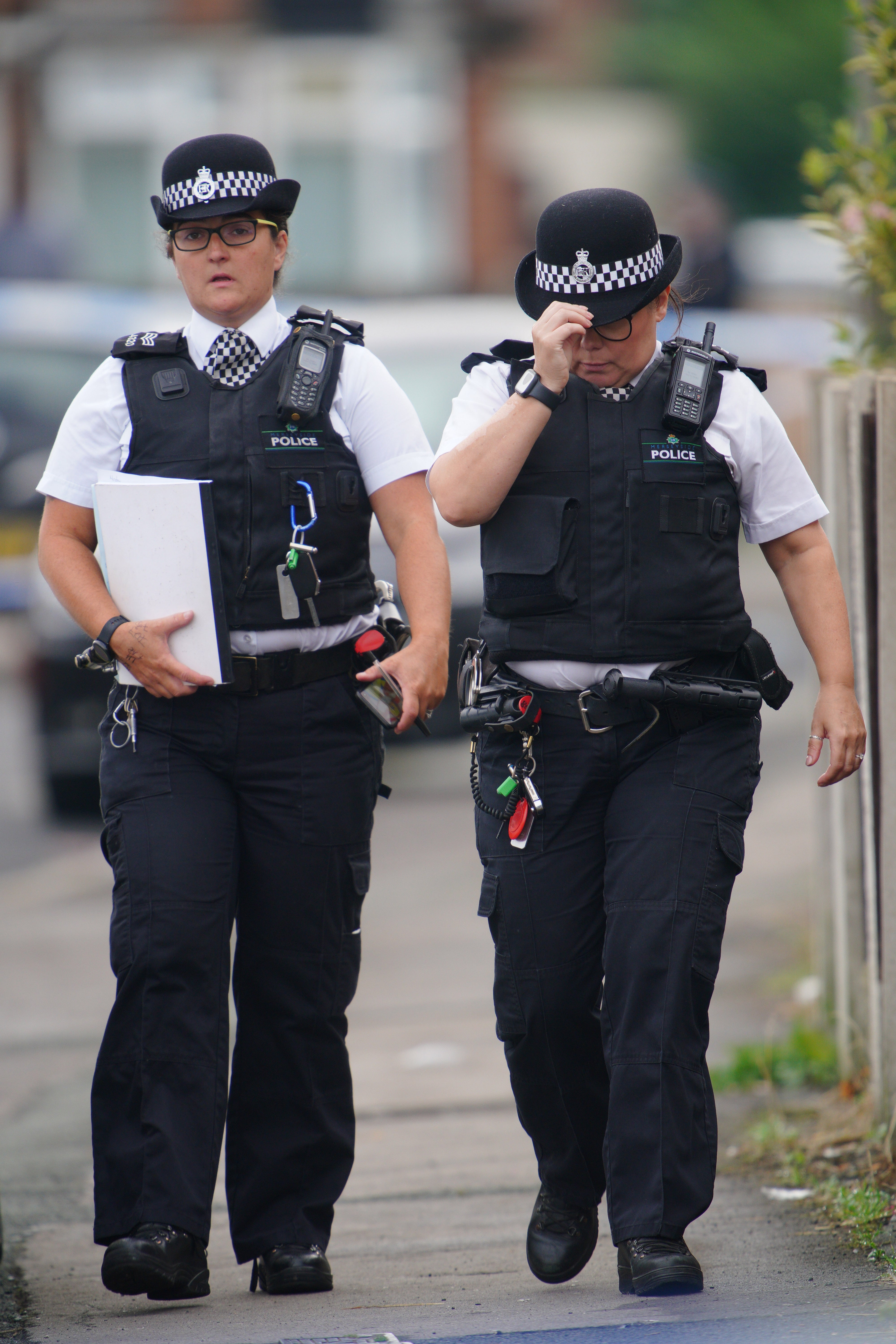 Police officers near to the scene in Kingsheath Avenue